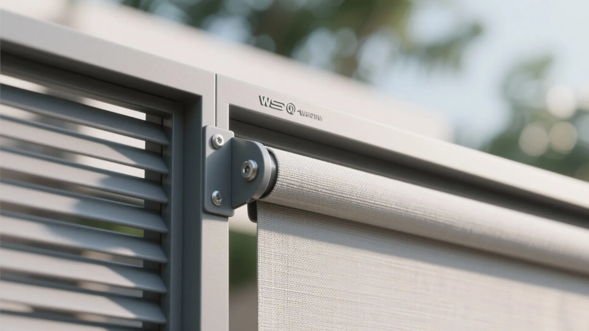 Close up of a grey outdoor curtain roller attached to a metal frame with screws
