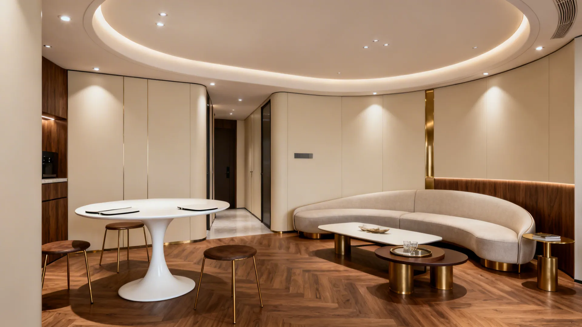 Compact living-dining room with a tulip pedestal table, curved sofa, and nesting tables in warm neutrals.
