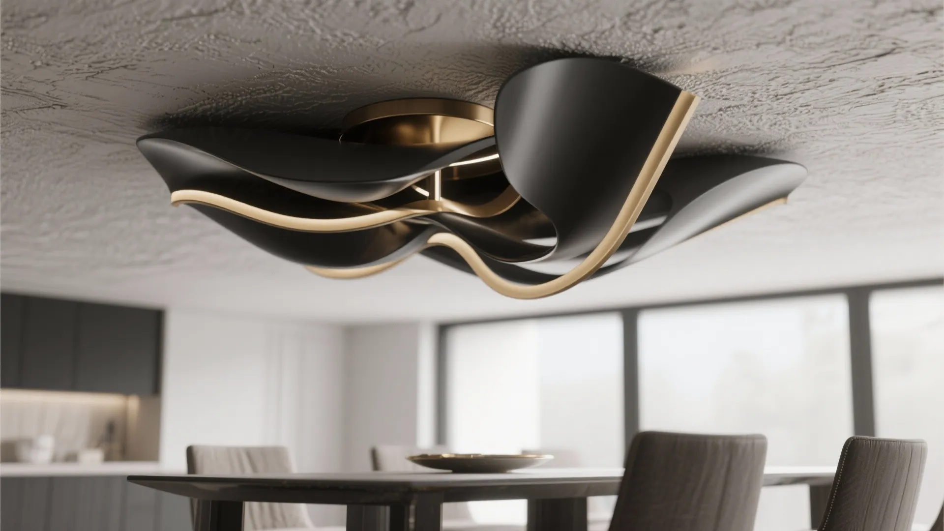 Close up of a wavy black and gold ceiling light fixture in a modern home interior