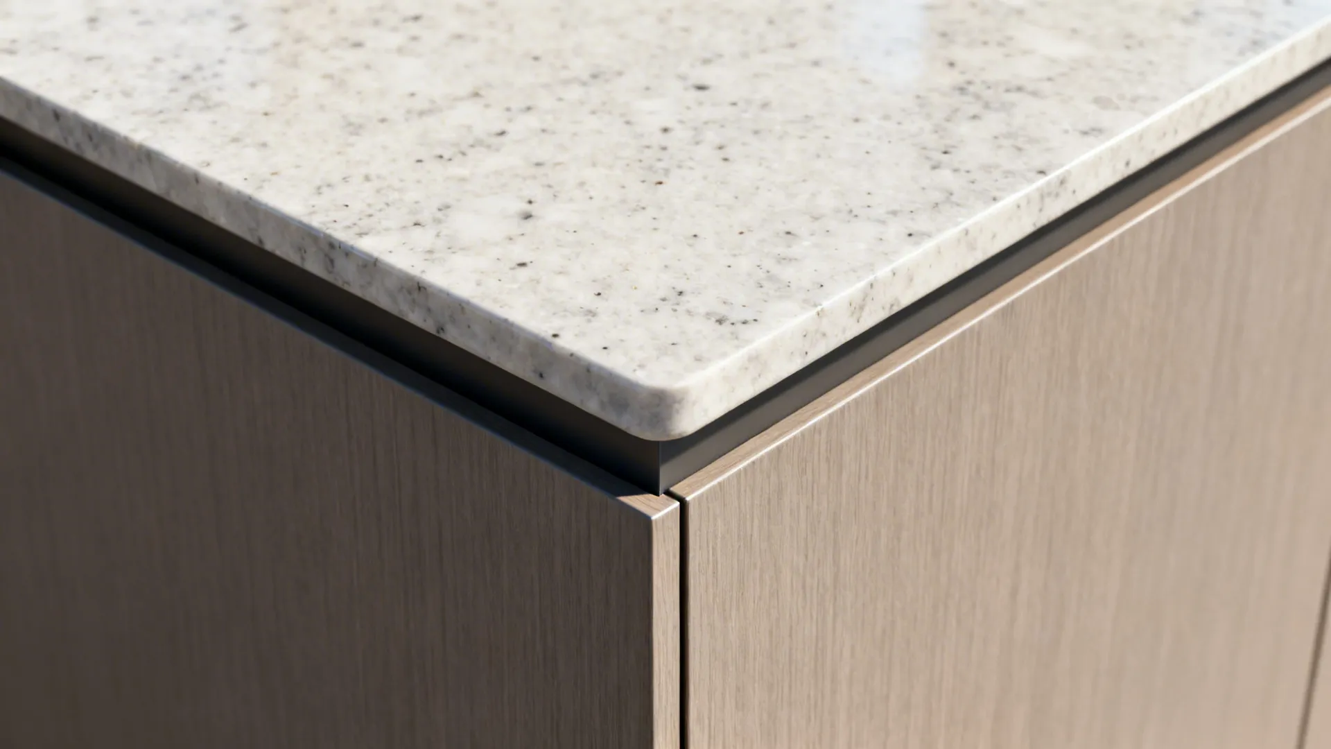 Macro view of quartz counter meeting cabinet with tightly sealed ABS edge.