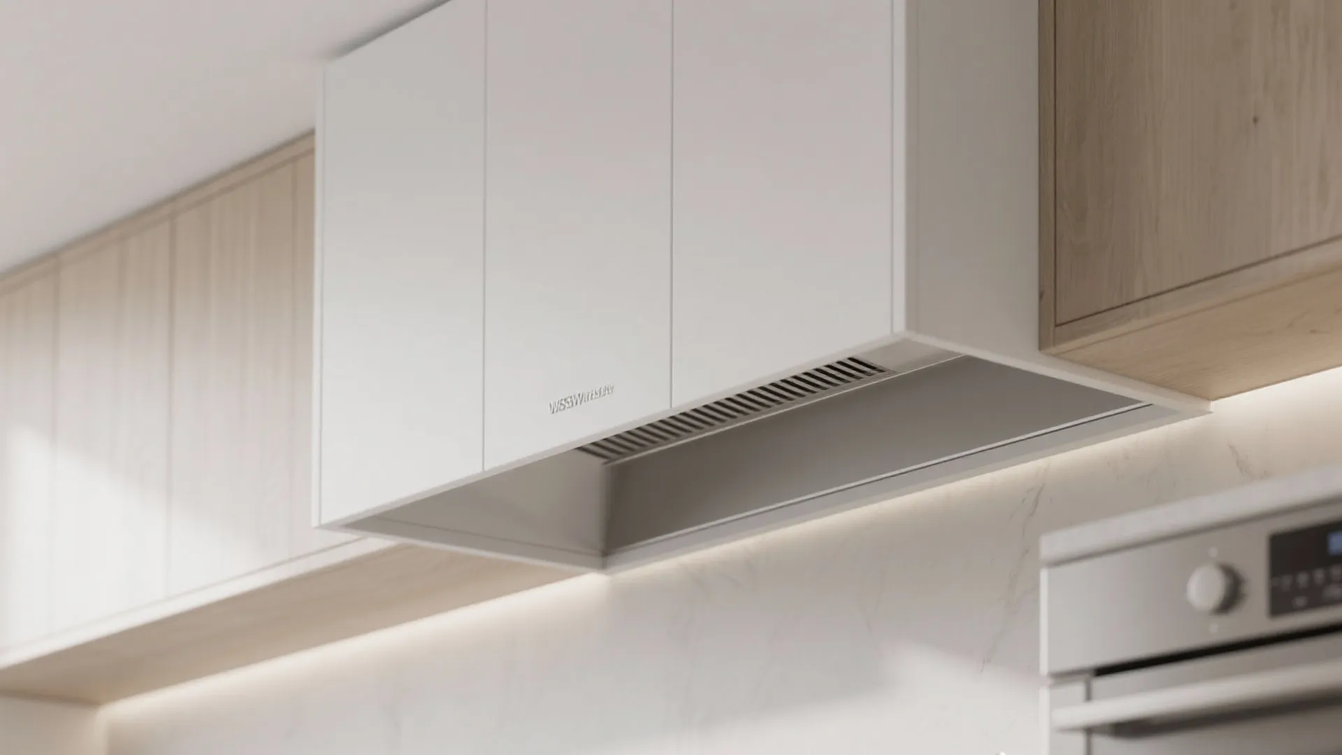 Modern white minimalist kitchen cabinet with an integrated range hood above a sleek marble wall