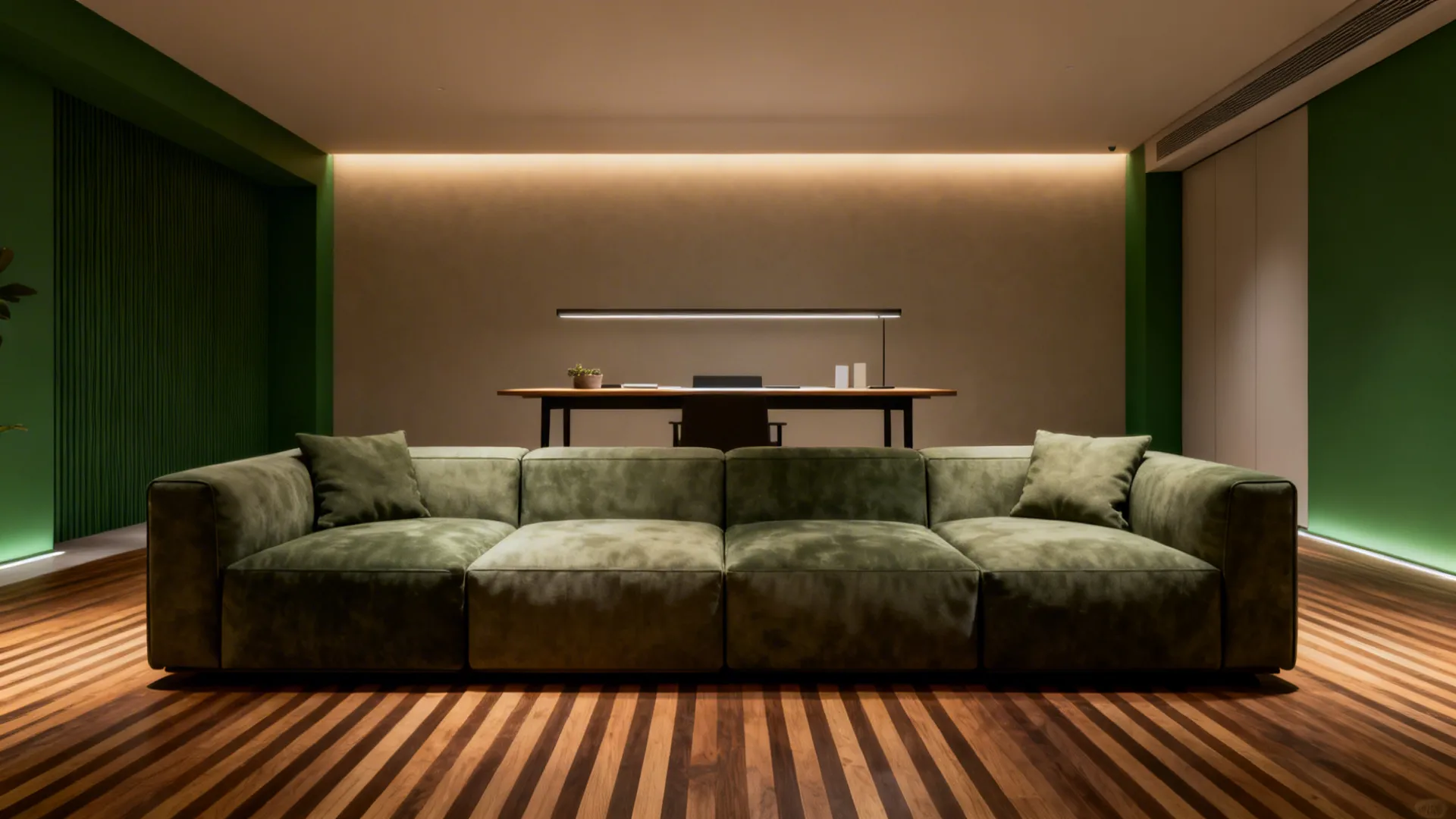 Modular sofa placed perpendicular to the length forming seating and a workspace behind it.