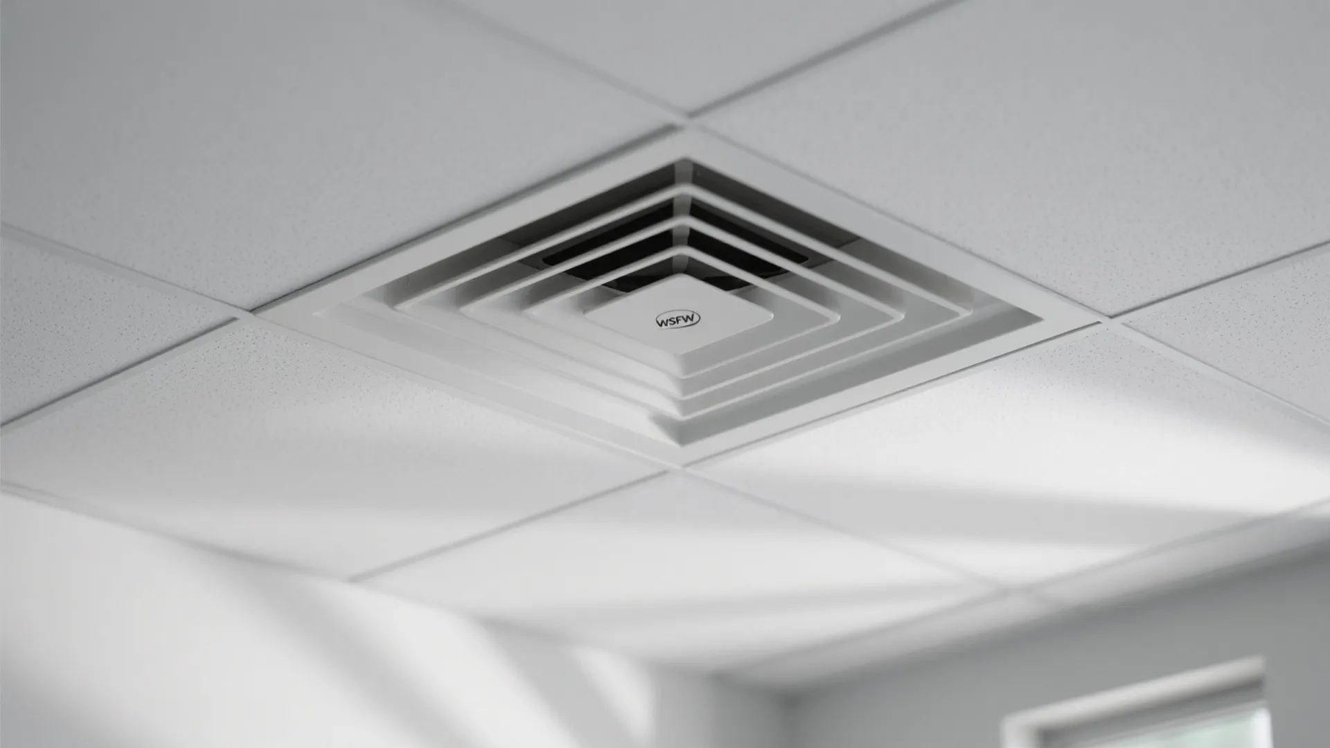 Modern white square air vent installed on a clean white tiled ceiling with soft natural light