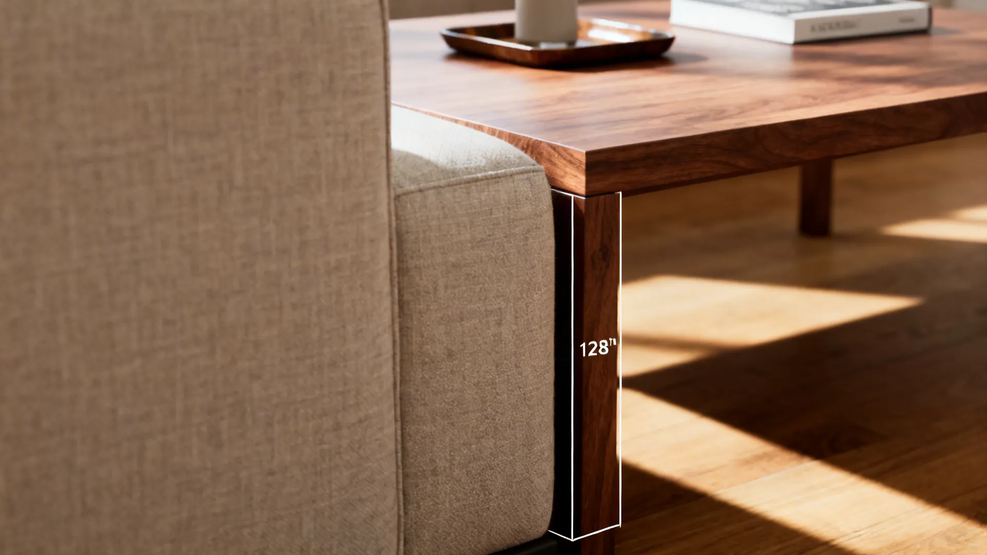 Close-up showing the recommended 12–18 inch gap between sofa and coffee table for comfortable legroom.