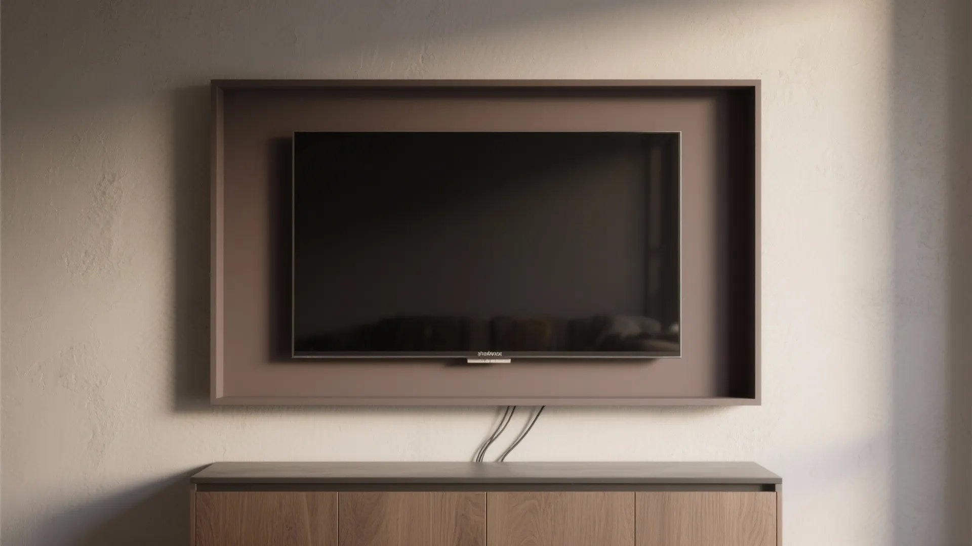 Modern television mounted inside a brown recessed wall frame above a wooden cabinet storage unit