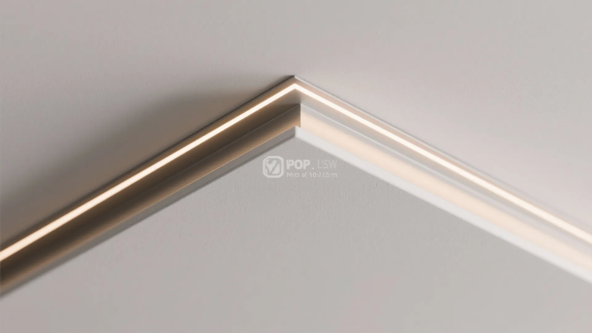 Close up view of a modern ceiling light fixture with a clean recessed shadow gap
