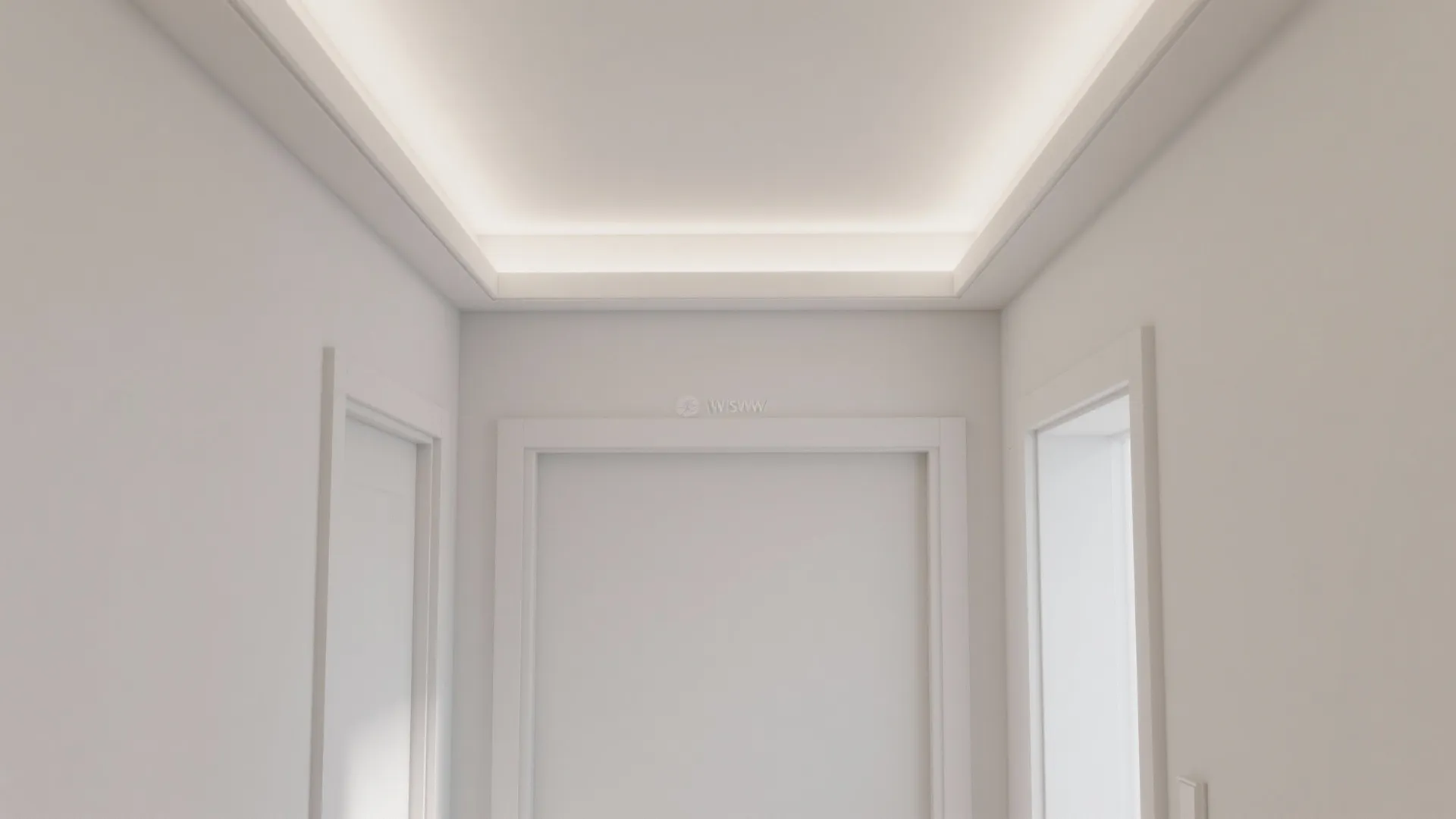 Crisp 12 mm shadow reveal and a subtle tray step create a floating ceiling effect in a narrow hall.
