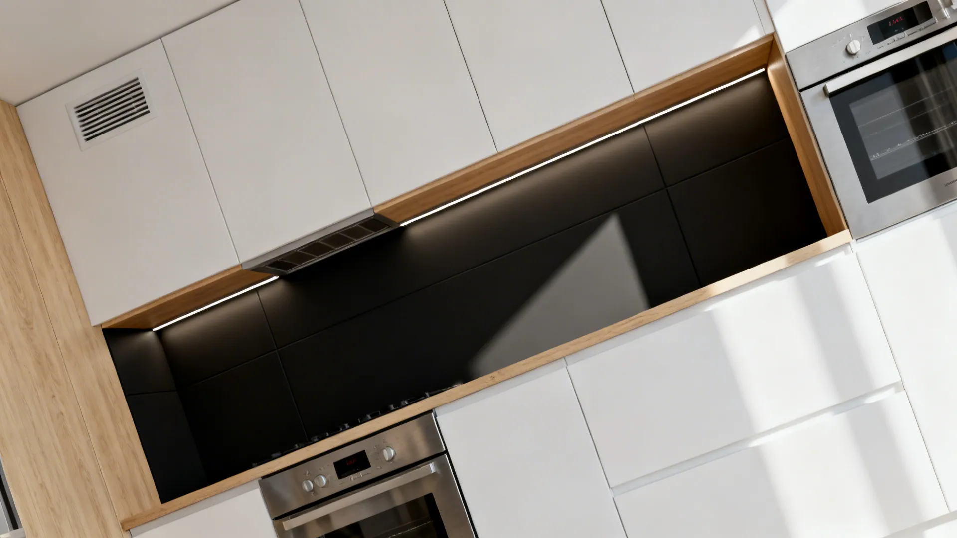 Compact kitchen with a continuous shadow-line recess hiding a slim ventilation path.