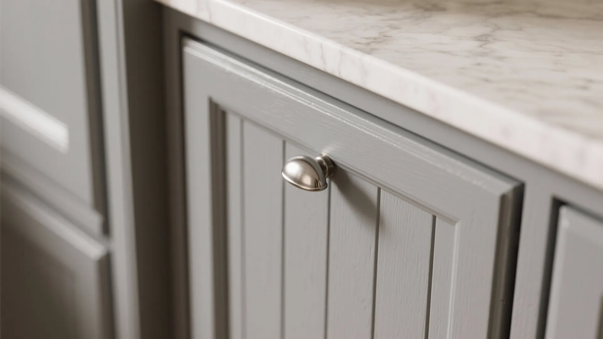 2. Shaker-style grey cabinet with countertop overhang