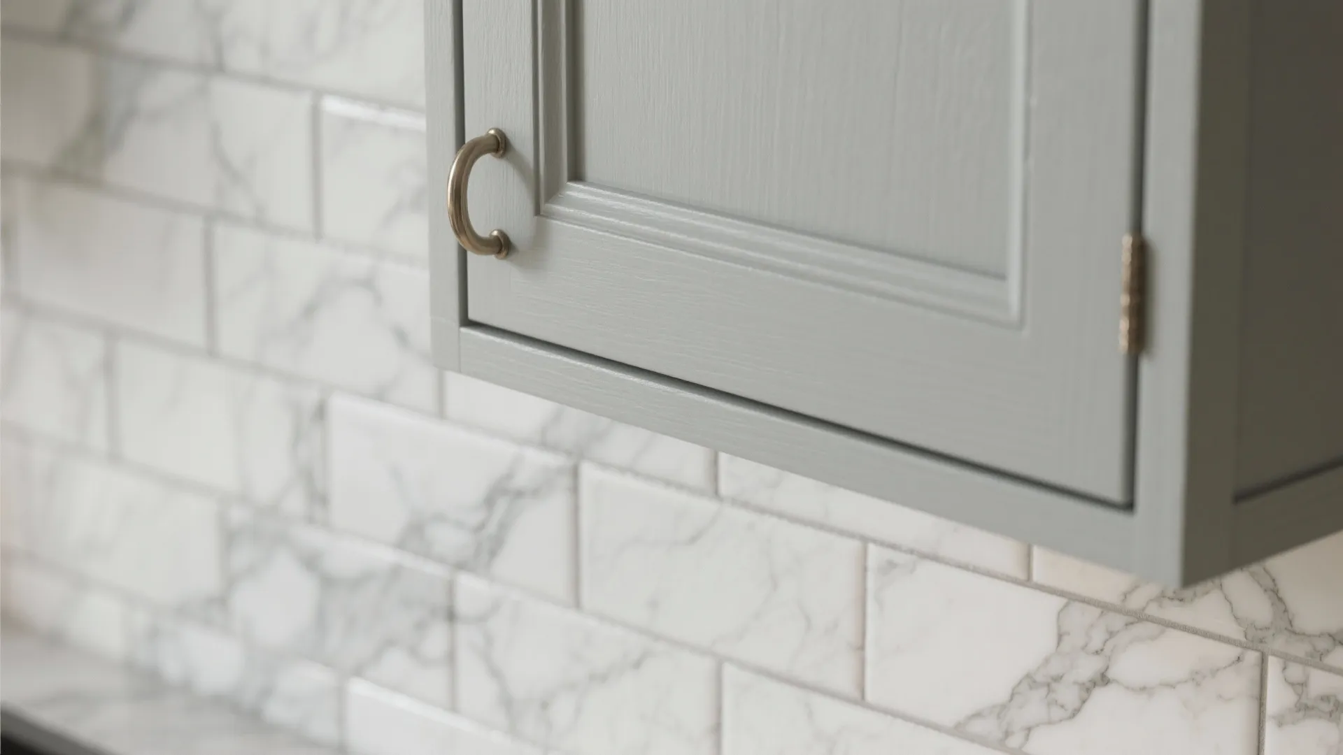 1. Light gray shaker cabinets with a subtle marble backsplash
