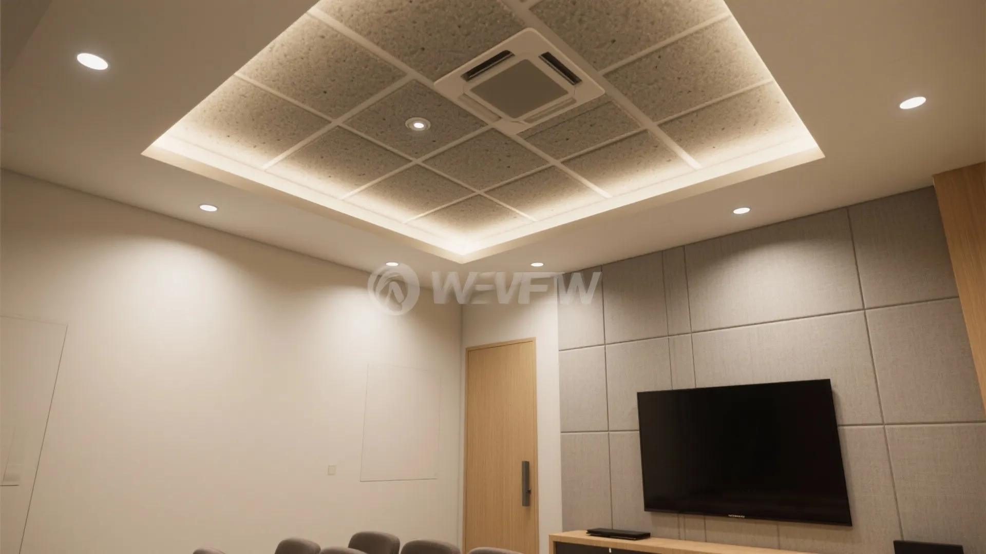 Modern room with grey wall panel, television, wooden door, and square grid ceiling light fixture