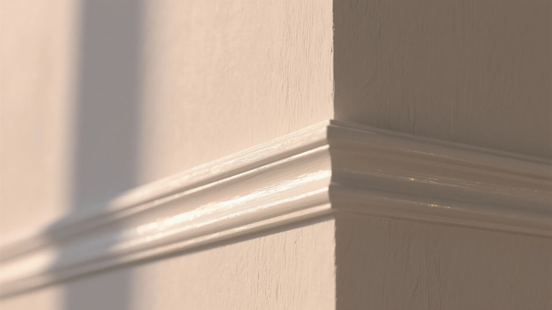 Close up of white wall panel trim on a corner with soft natural light shadows