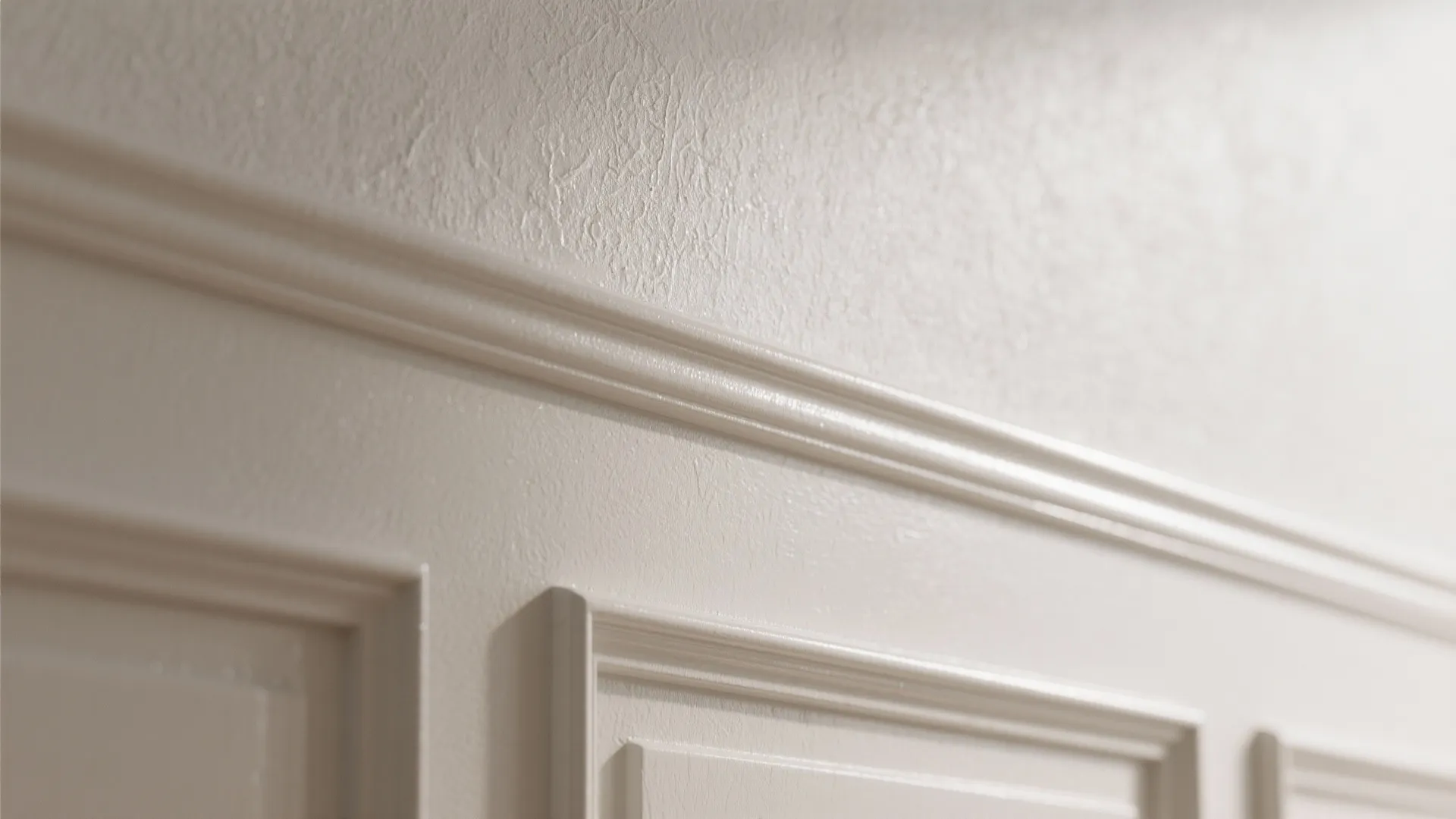 Close up view of white wall panel design with clean lines and smooth painted finish