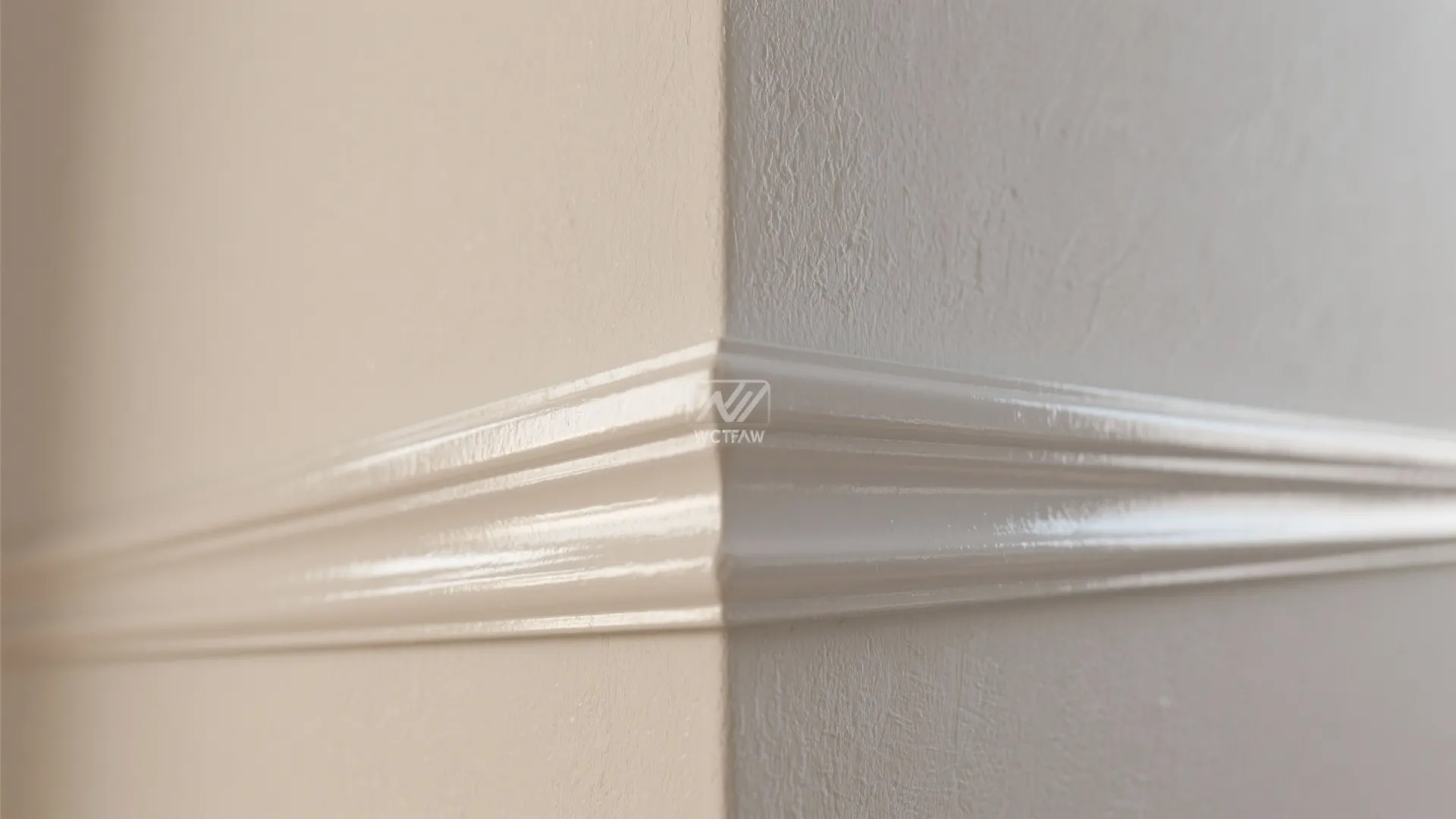 Close up of glossy white wall panel installed on a beige wall for interior home decoration