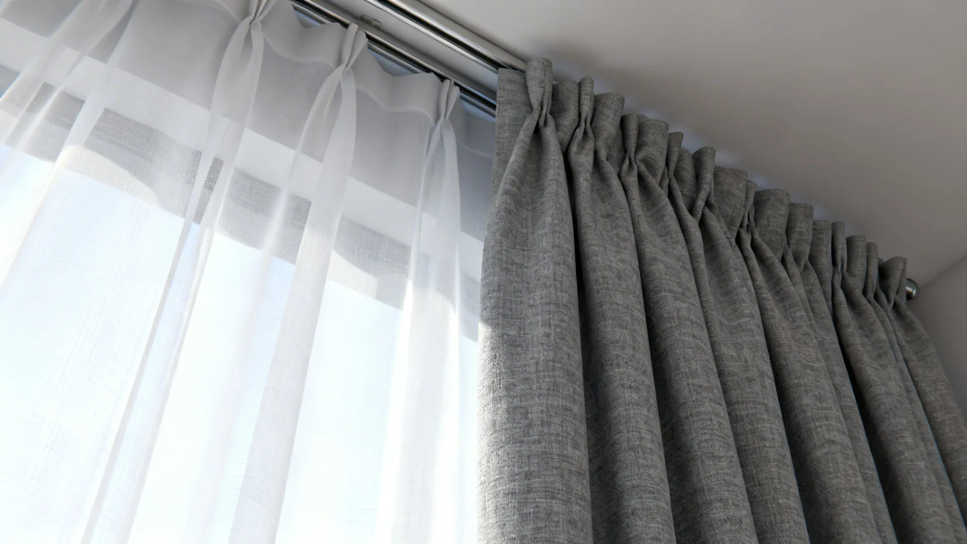 Close-up of white sheer layered over grey blackout curtain showing fabric texture and ceiling track.