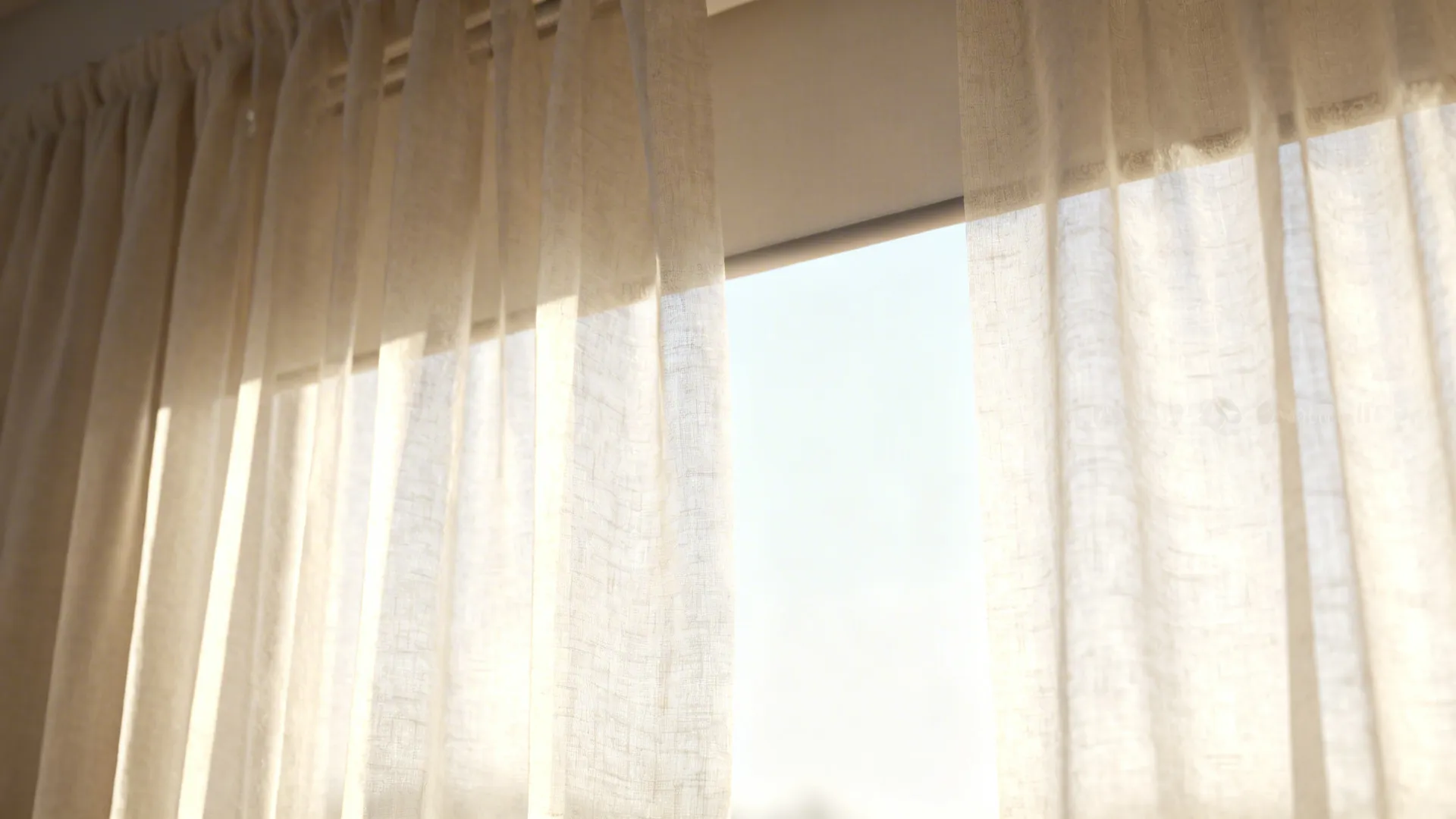 Close-up of sheer curtain fabric backlit by daylight with a roller shade behind.