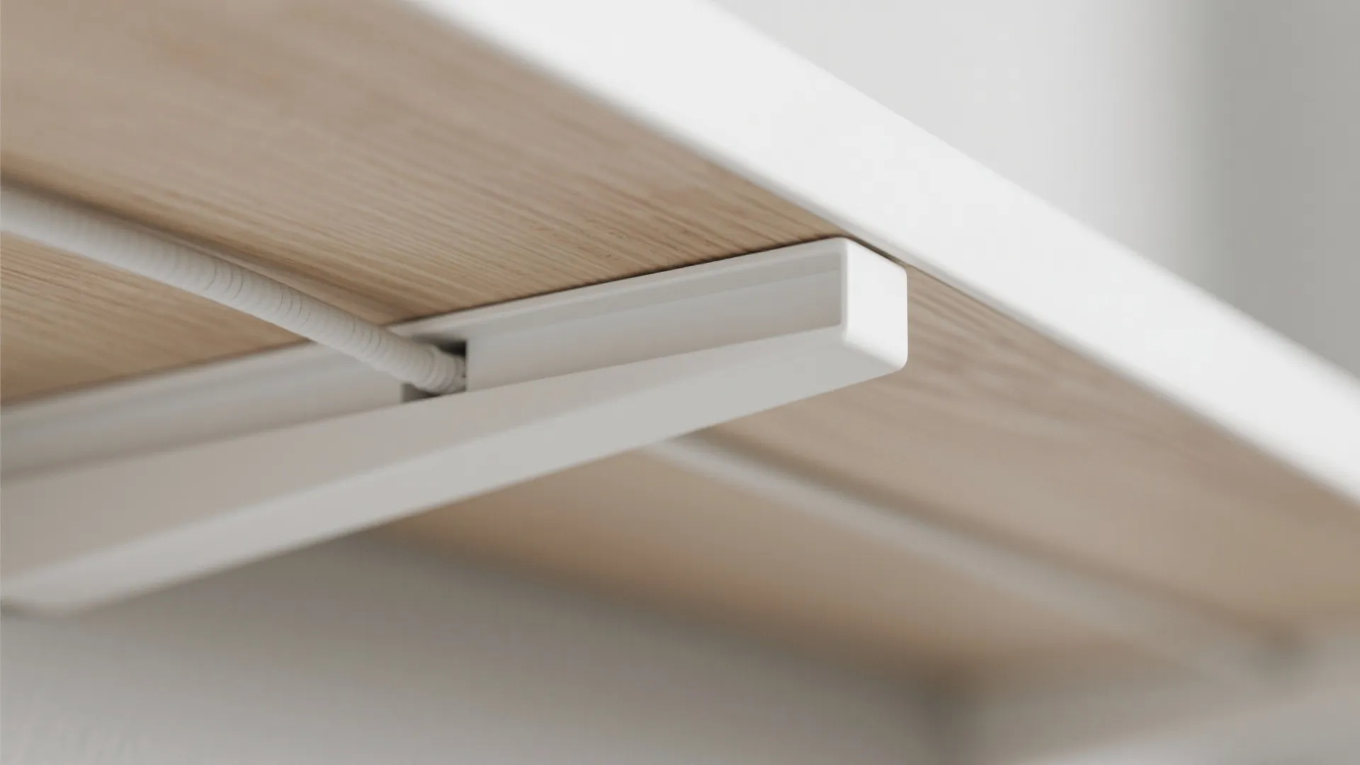 Close up view of white shelf bracket with hidden light cable running through the support