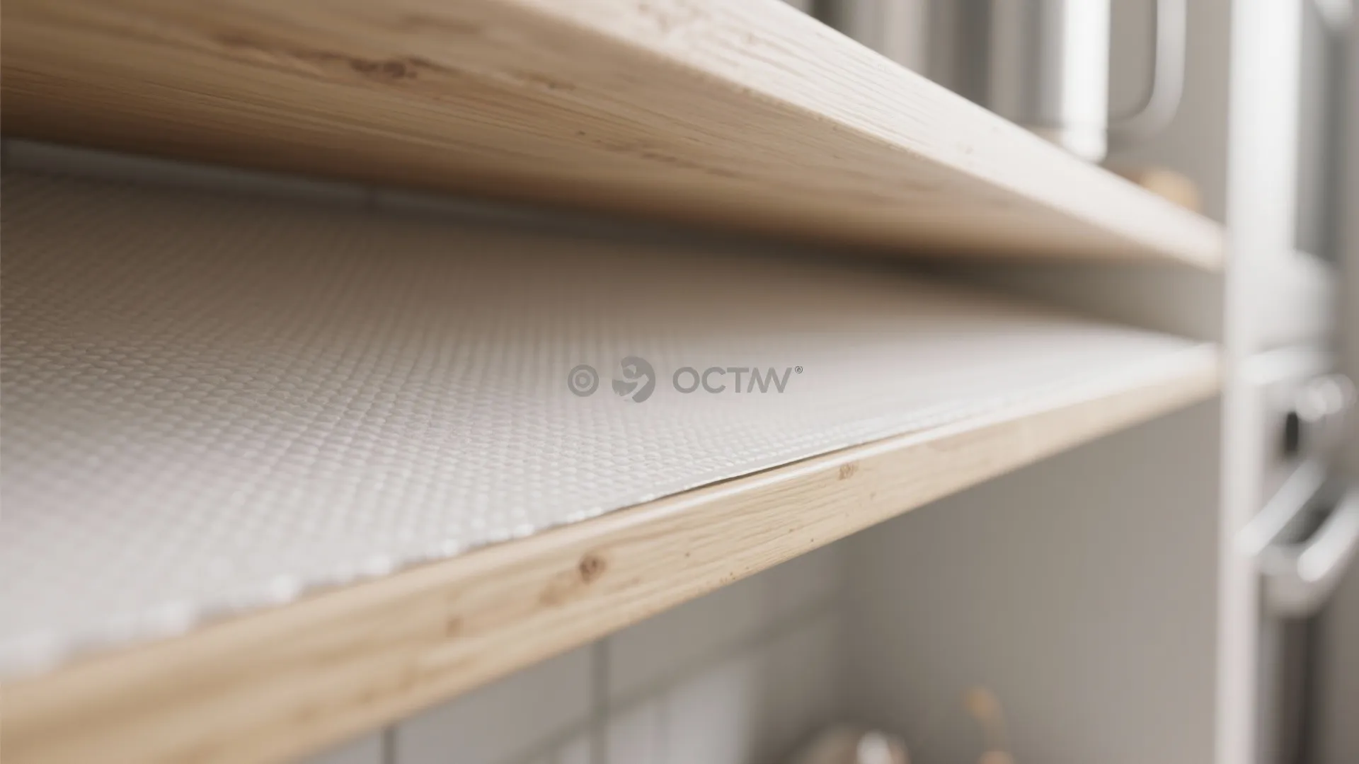 Close-up of washable shelf liner and sealed plywood edge for easy-clean open shelving.