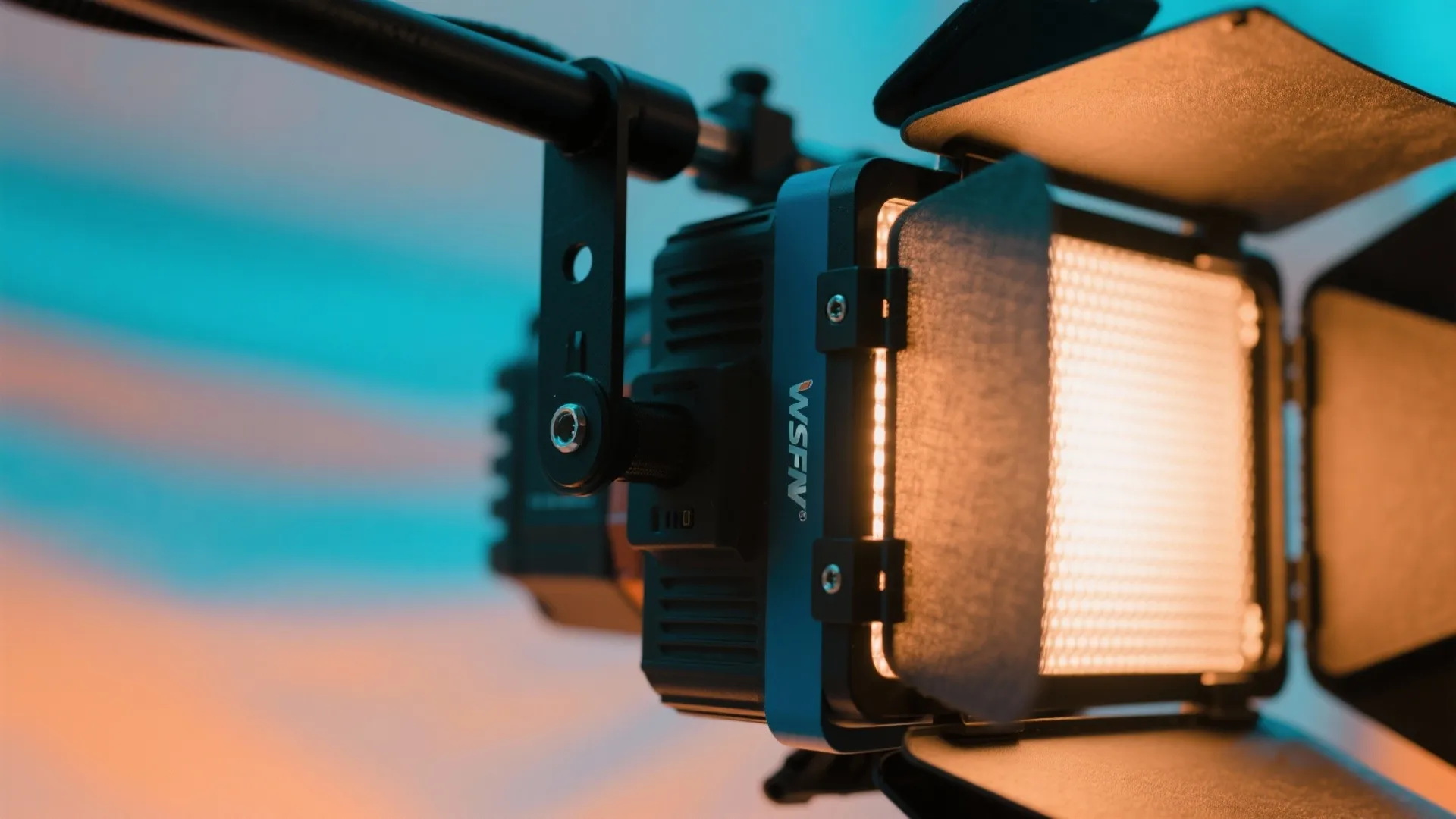 Close up view of a professional light fixture showing bright led panel and barn doors