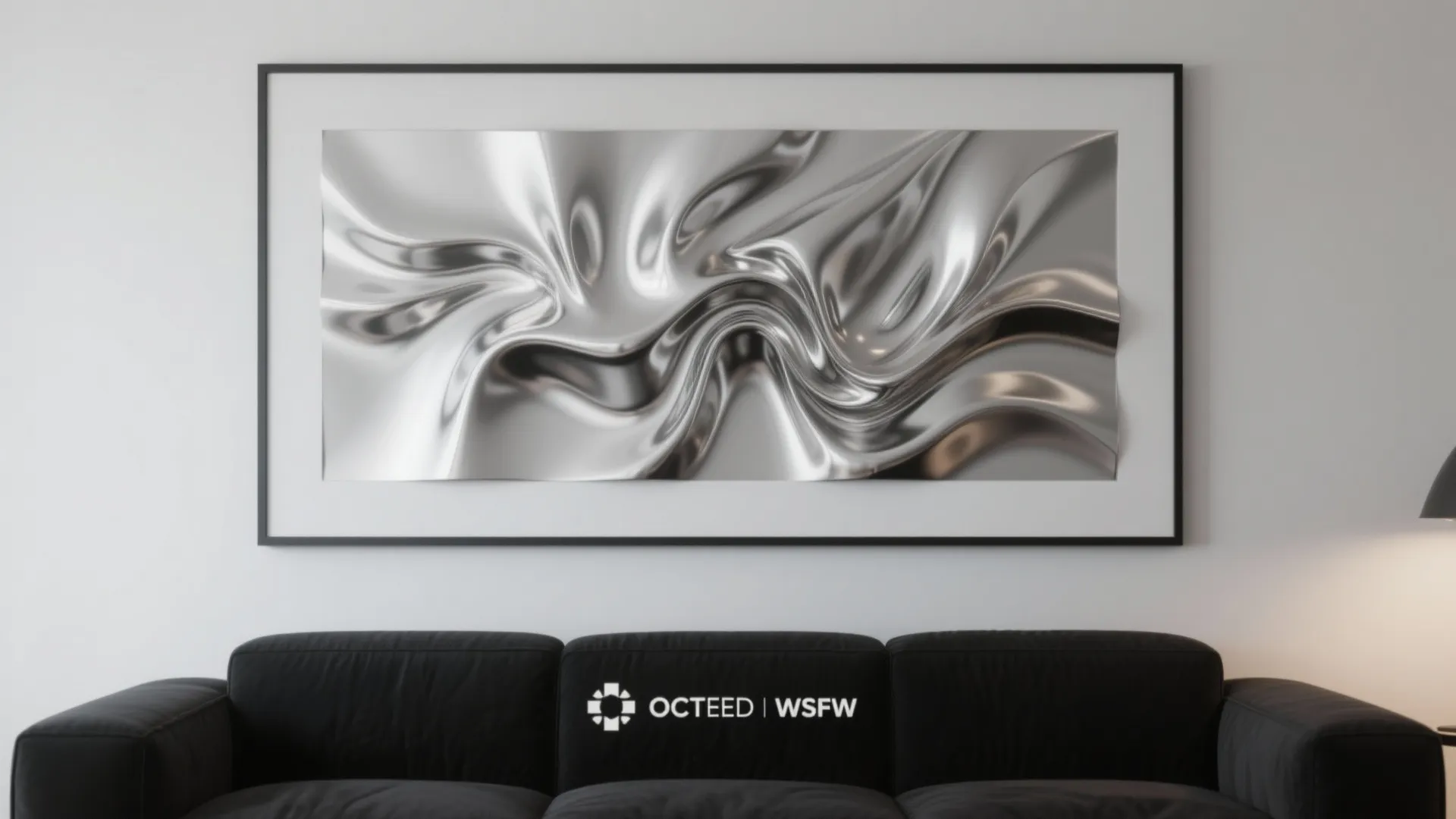 Modern living room with black sofa and large silver liquid metal wall art in frame