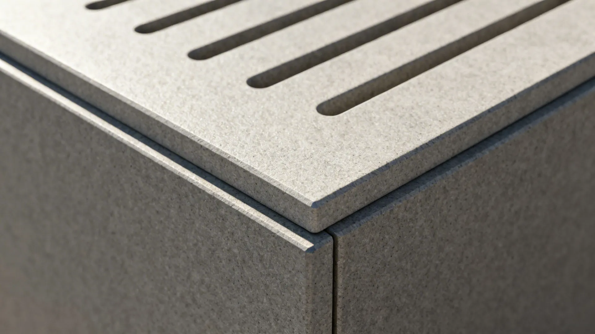 Macro of sintered stone with matte finish, drain grooves, and micro-beveled edge.