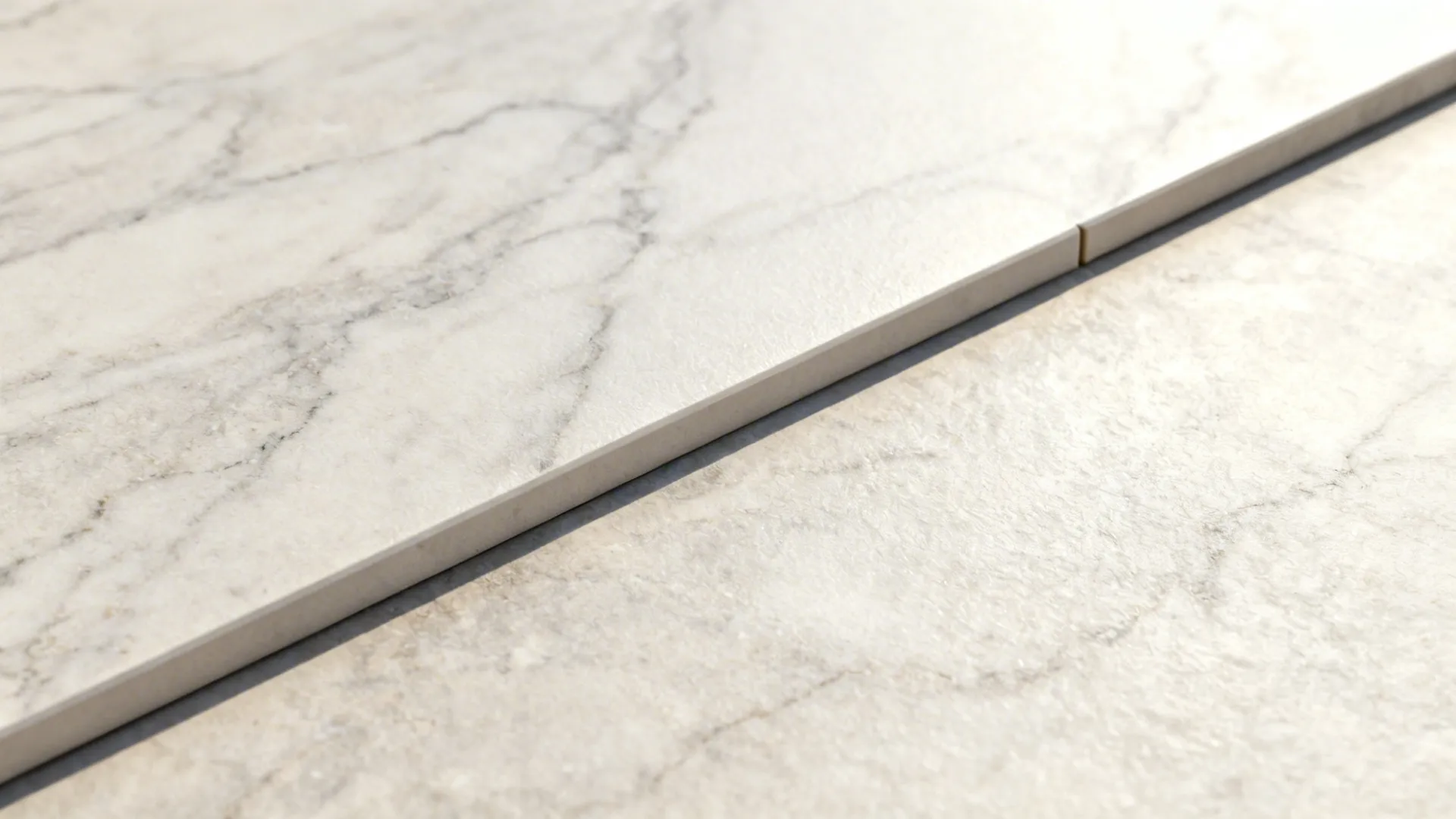 Macro of large-format porcelain slab with subtle stone veining and a clean seam.