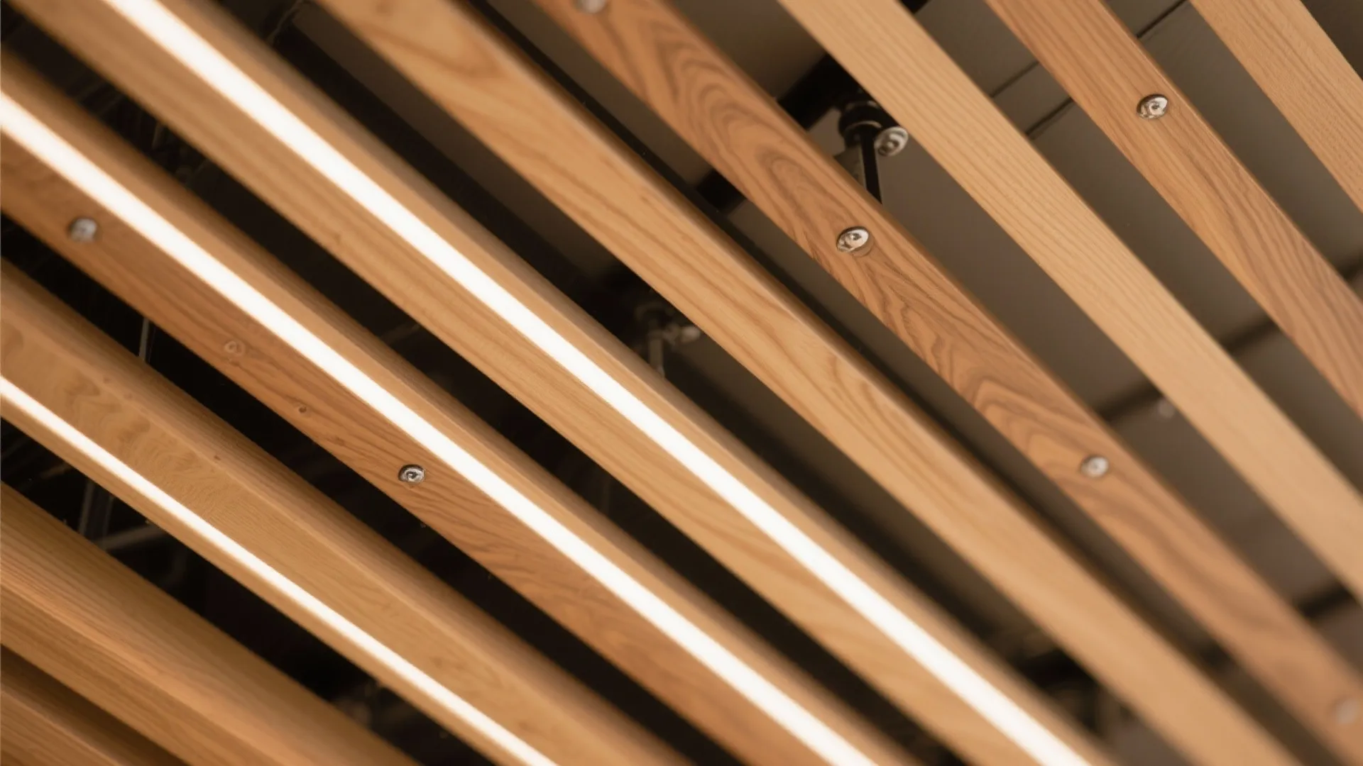 Macro of engineered oak slats with UV finish and diffused light between gaps.