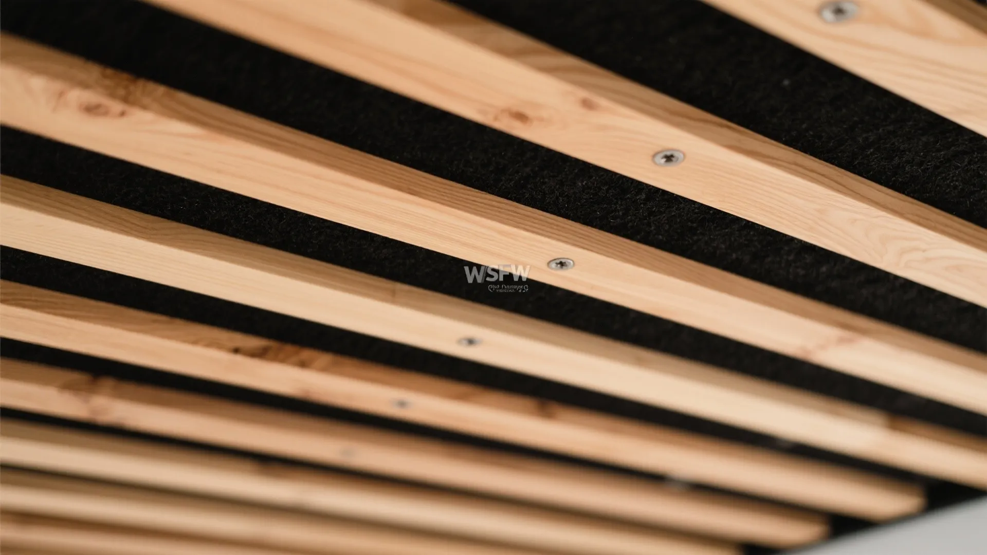 Wood slat ceiling with acoustic backing