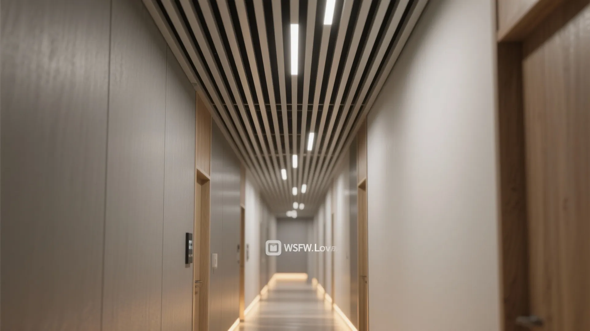 Narrow hallway extended visually by linear slat PVC ceiling and integrated strip lighting.