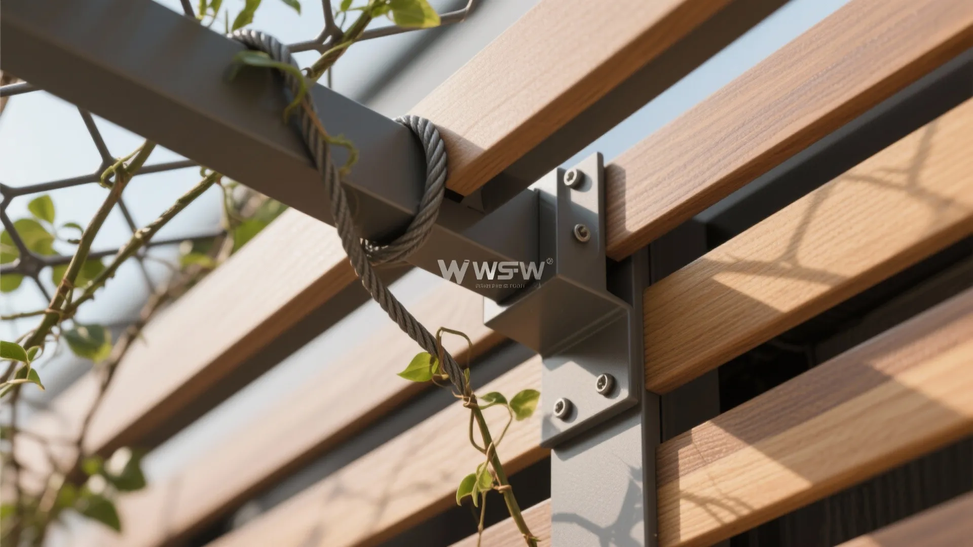 Wooden slats attached to grey metal frame with screws and green climbing vines on wires