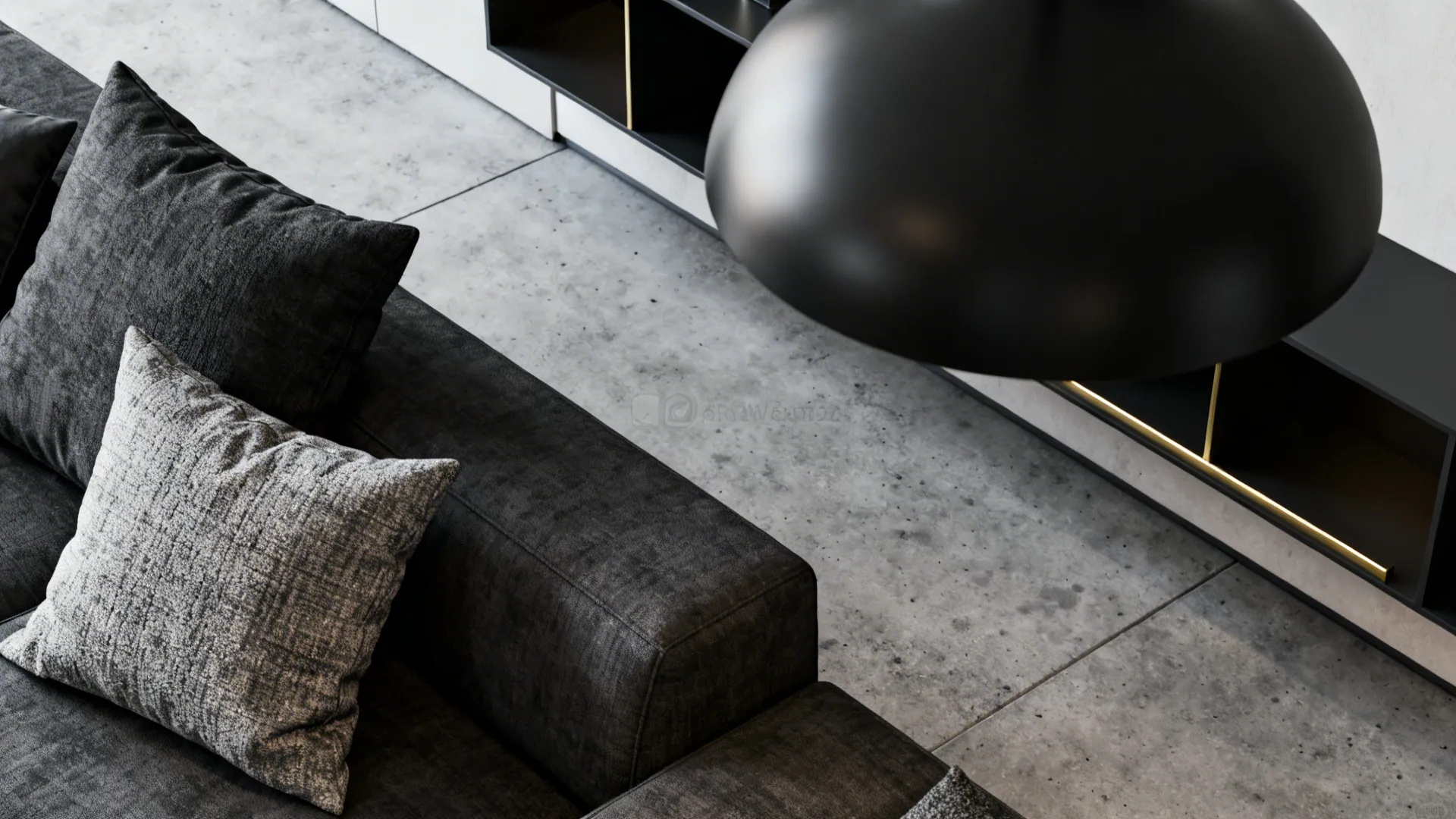 Close-up of tactile fabrics and concrete-look flooring in a sleek monochrome living room.