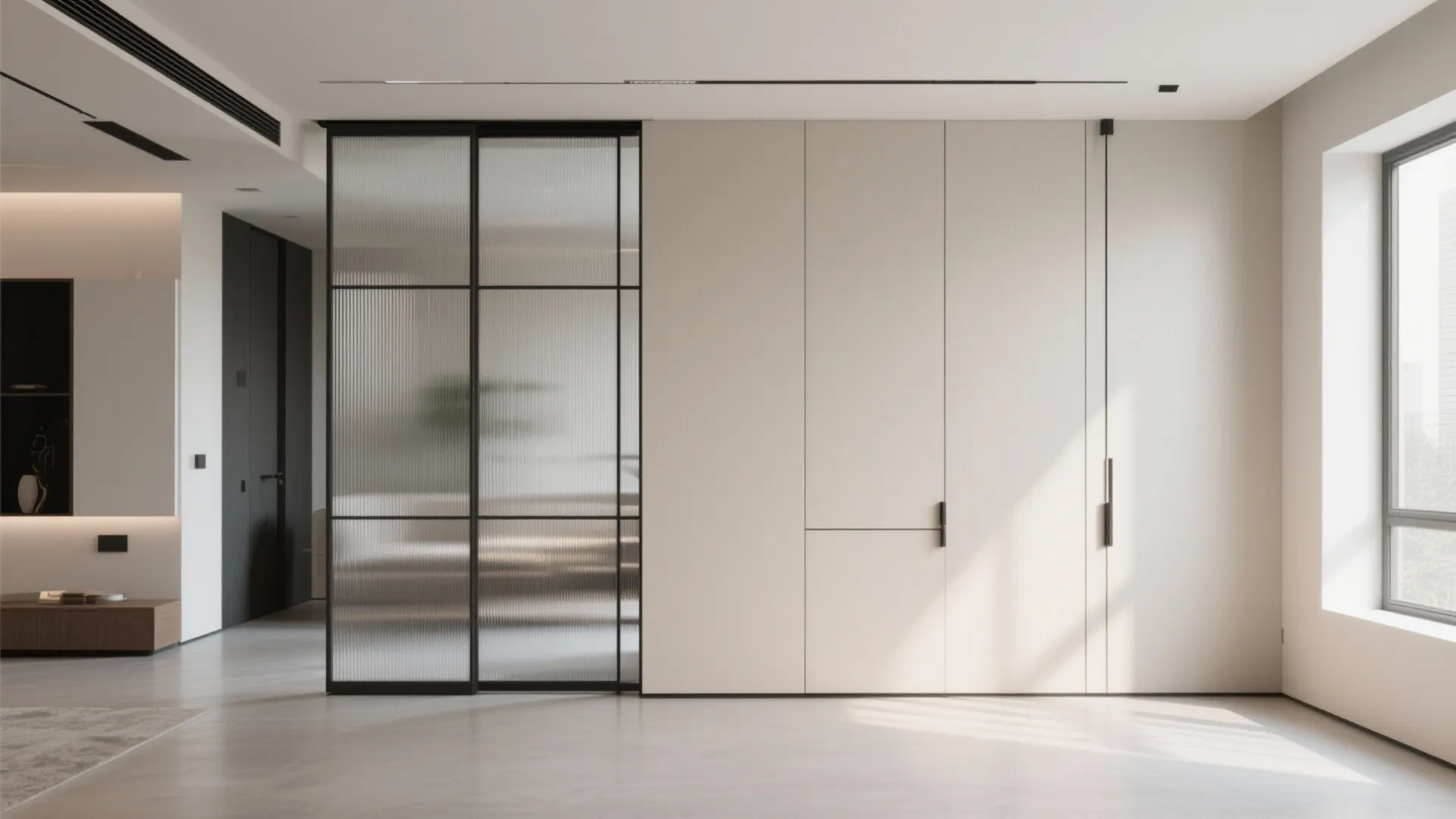 Modern minimal living room featuring black frame glass sliding doors and white built-in storage cabinet