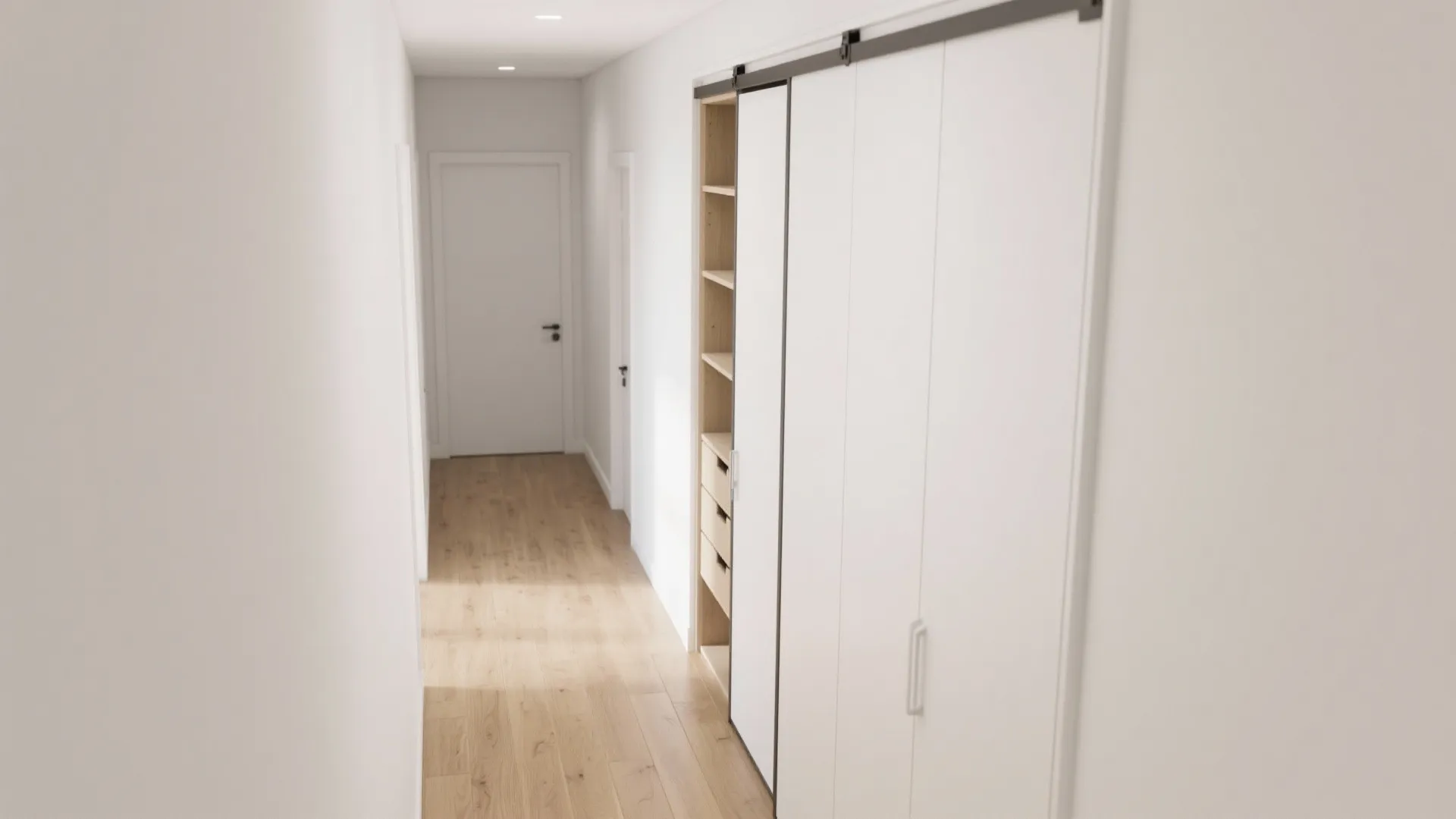 Narrow white hallway featuring a large sliding door cabinet with wooden shelves and light flooring