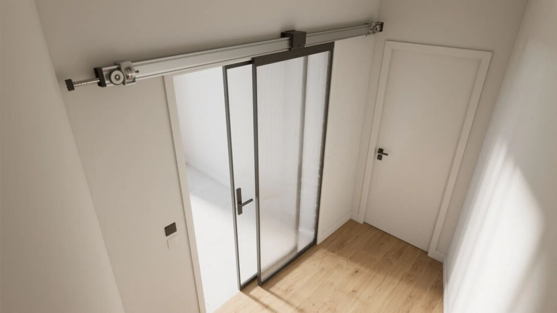 Modern sliding glass door with black frame and ribbed glass panel installed on wall track