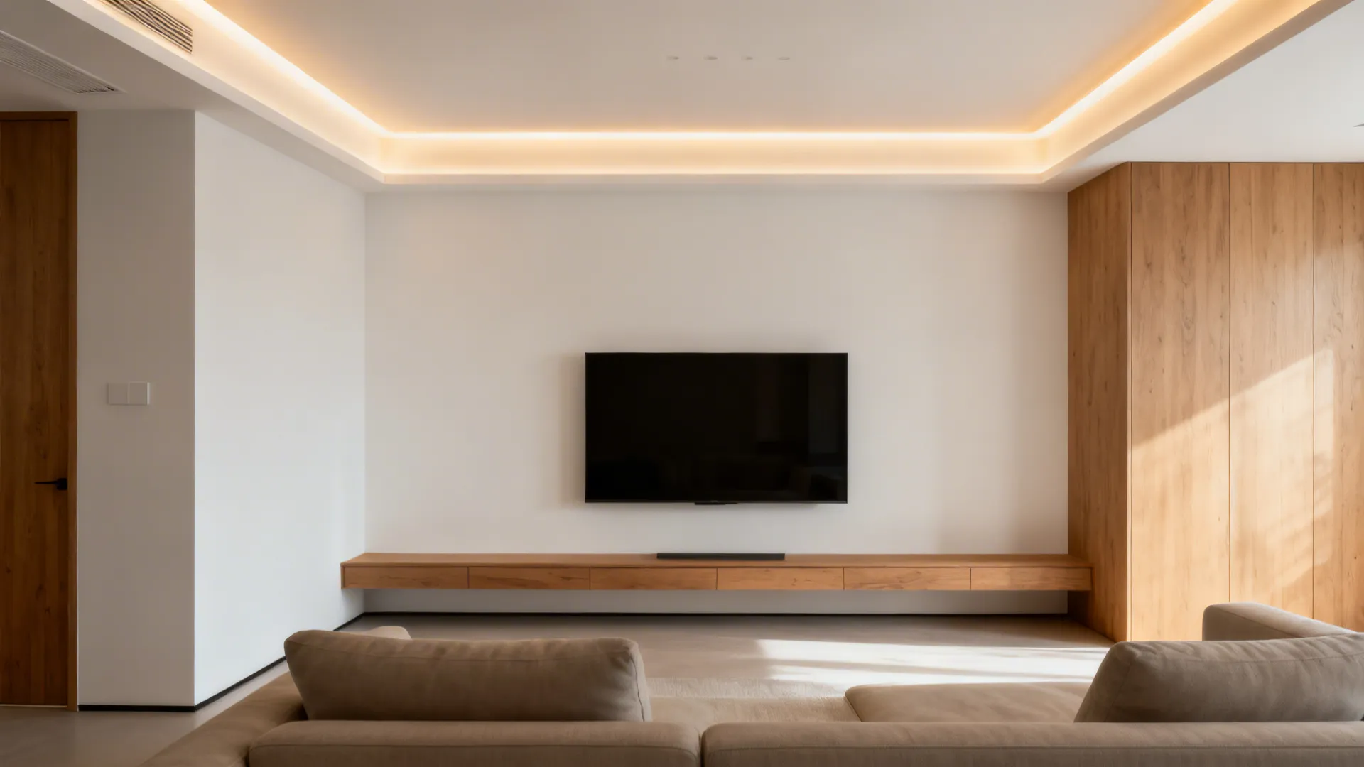 Slim recessed POP border with warm cove LED floating above a compact living room.