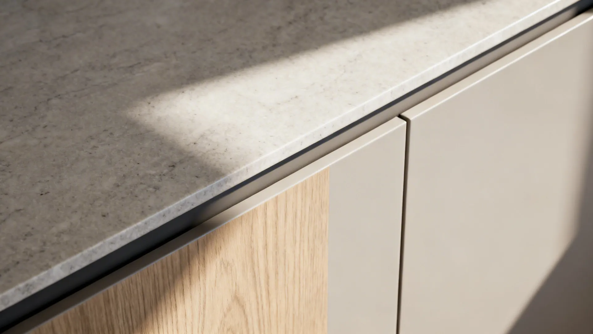 Macro of a 20 mm slim quartz edge aligned with a handleless cabinet front.
