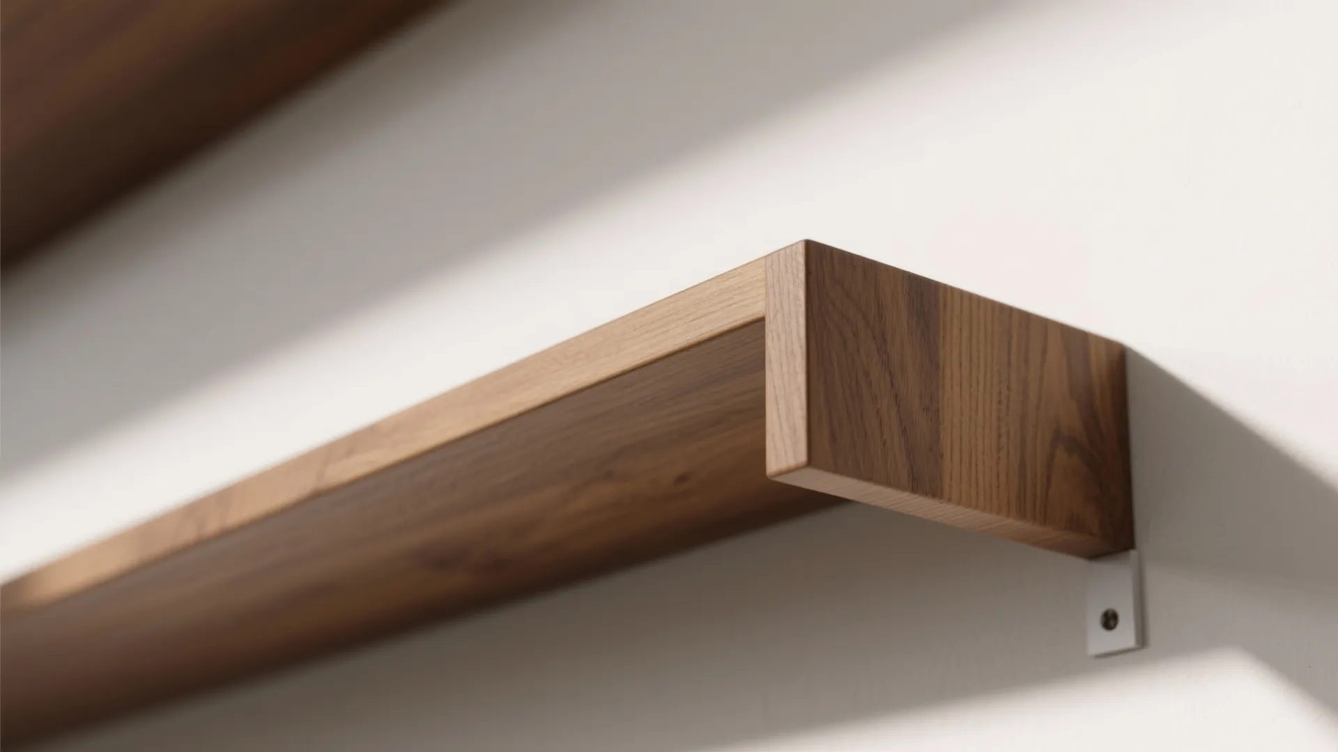 Macro view of an oak floating shelf edge with concealed bracket shadow line.