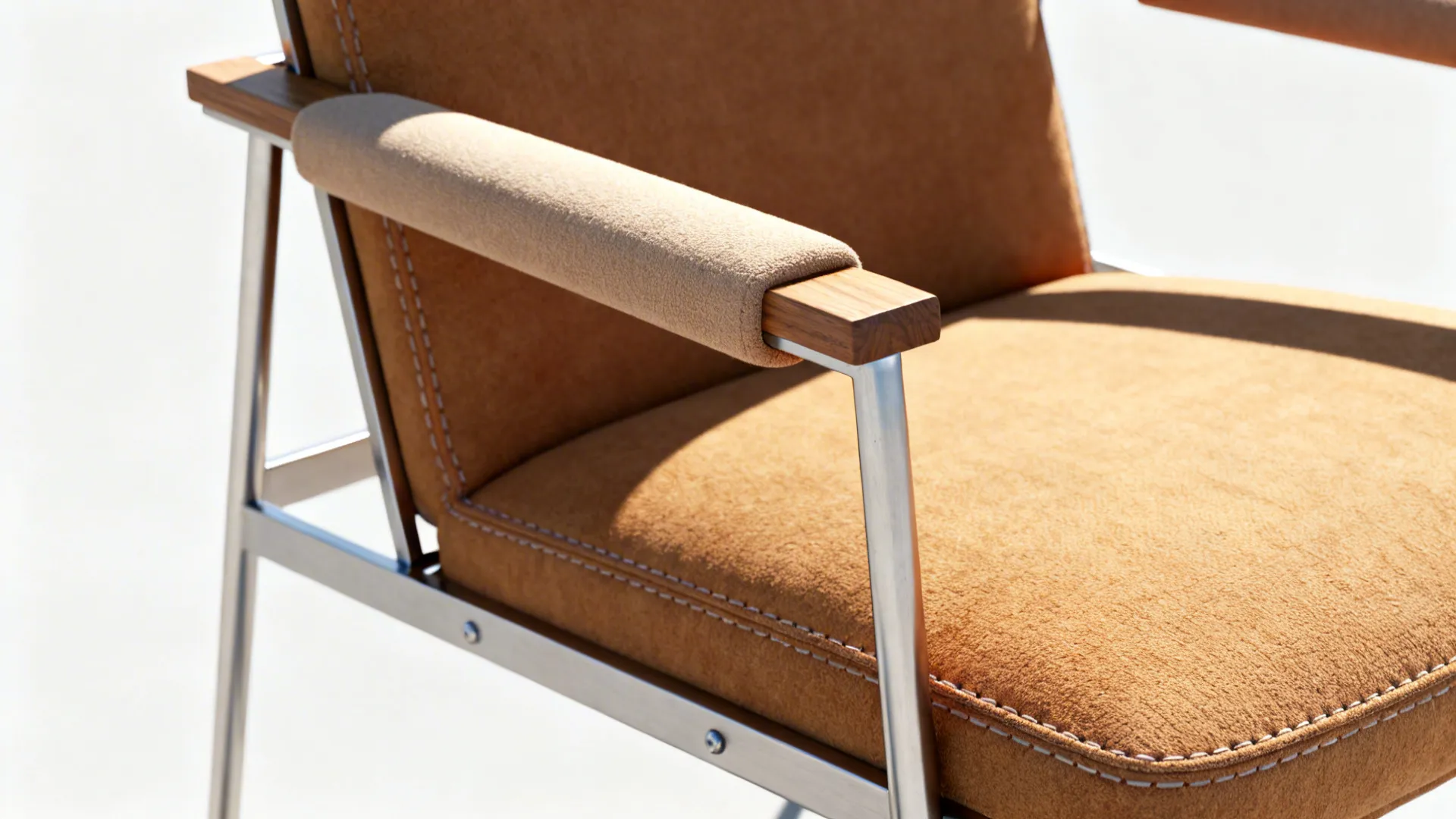 Slim-framed armchair with lightly padded arms and warm upholstery detail