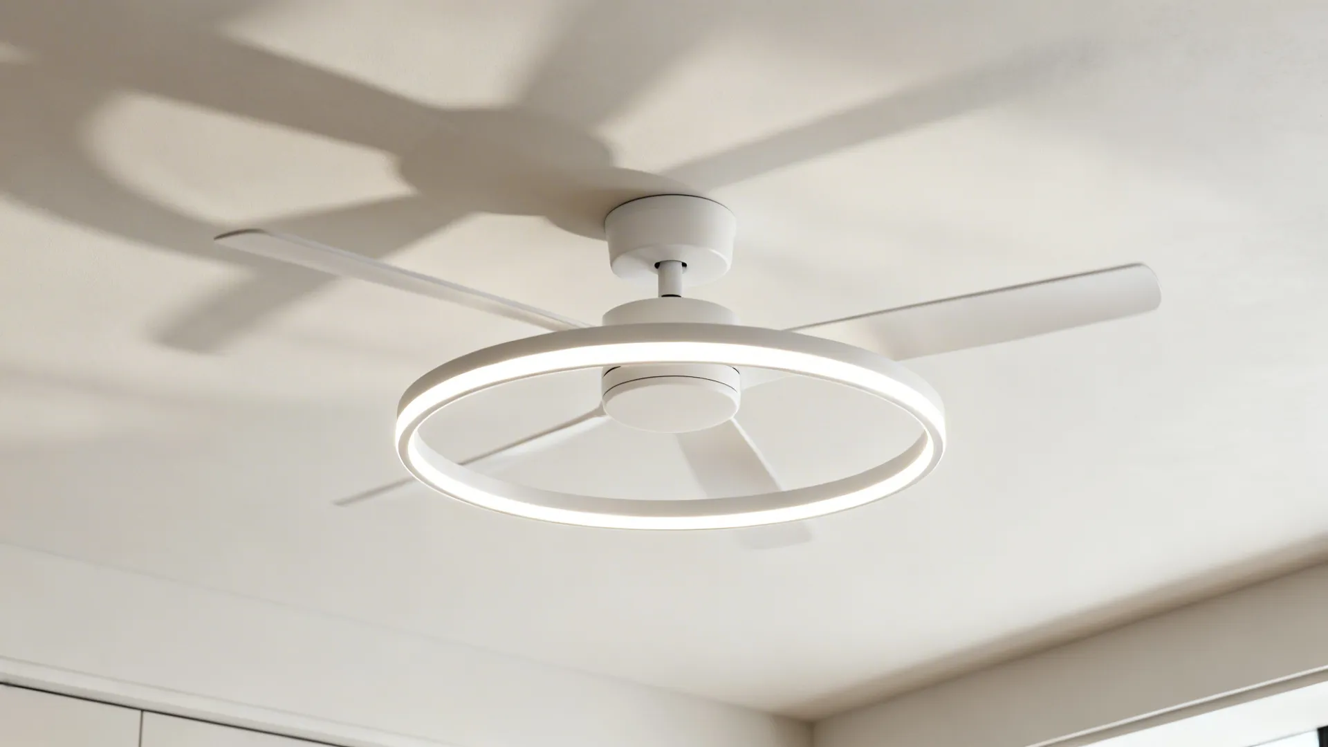 Low-profile slim LED ring chandelier-fan with integrated LED and thin blades on a low ceiling.