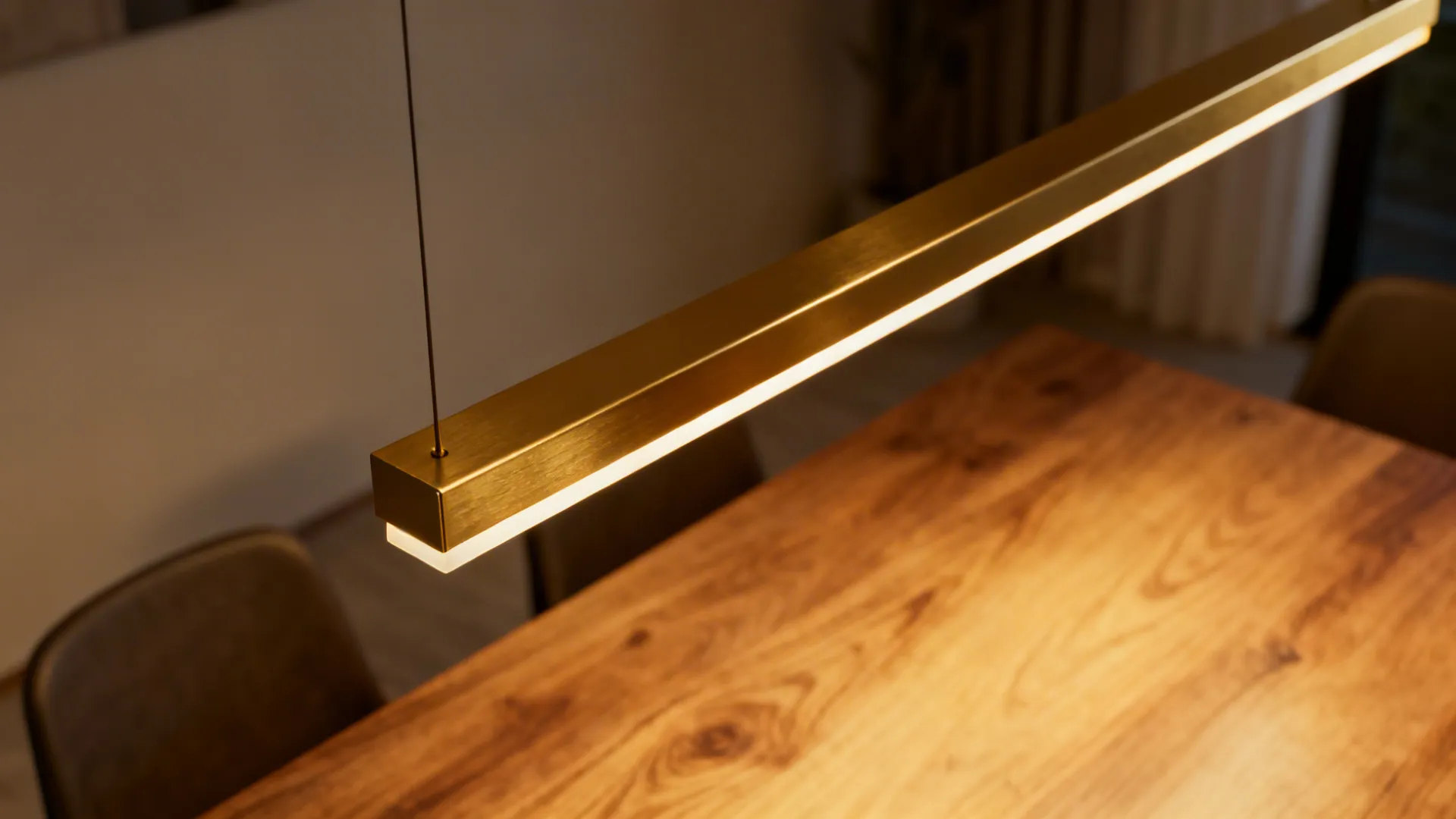 2. Slim linear pendant over the table
