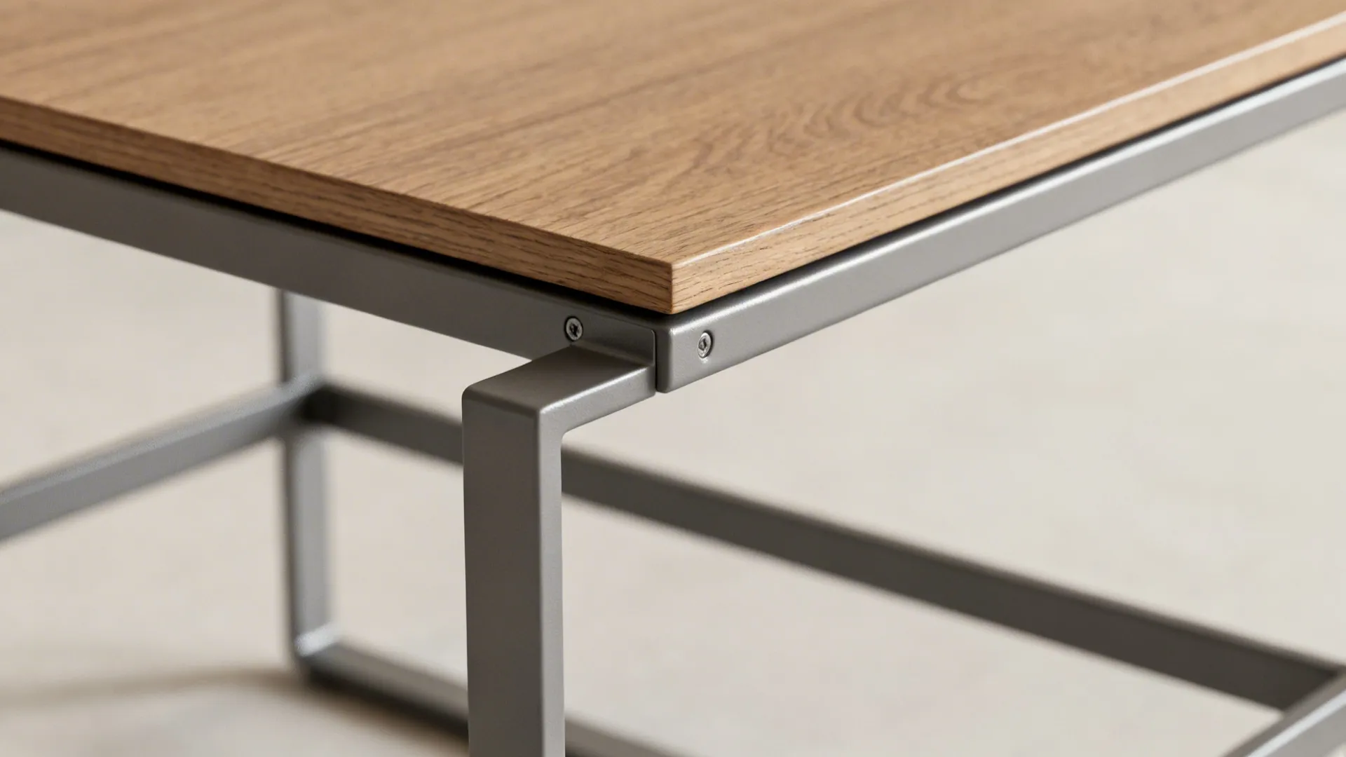 Close-up of slim metal-frame end table showing sturdy joinery and wood veneer top