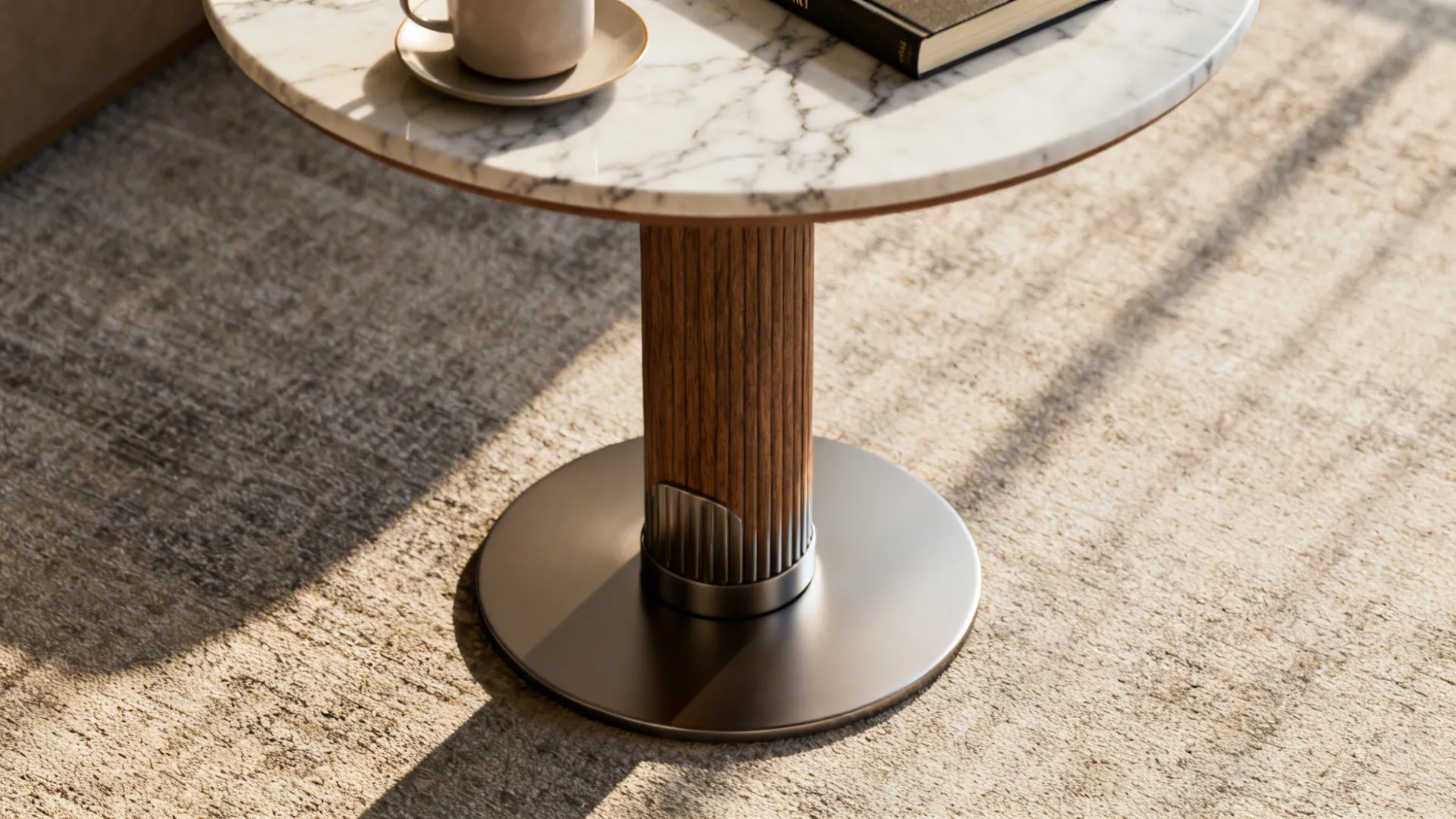 Macro detail of a slim pedestal table showing weighted base and tabletop materials