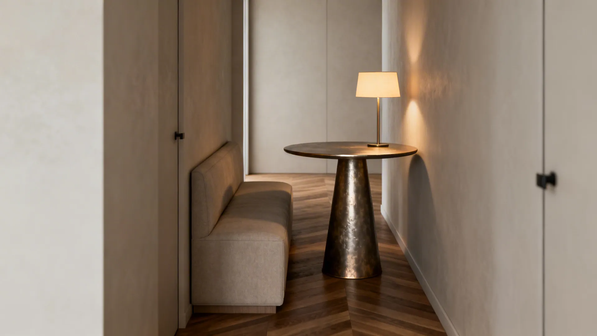 Slim pedestal round table in a tight walkway beside a narrow sofa, showing good circulation.