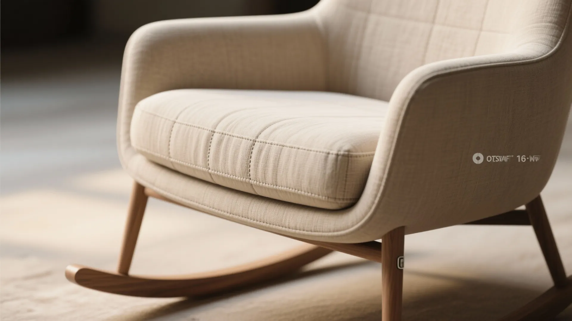Modern cream rocking chair with wooden legs on a light carpet in a bright room