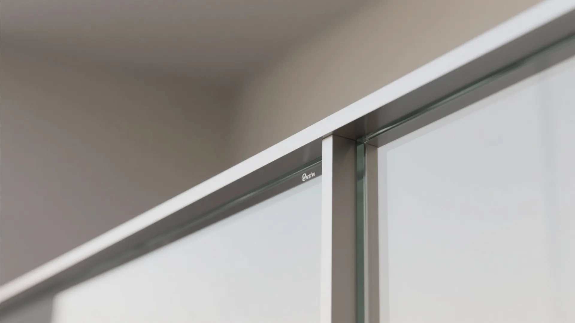 Close up view of a modern glass railing with slim metal frame for a balcony design