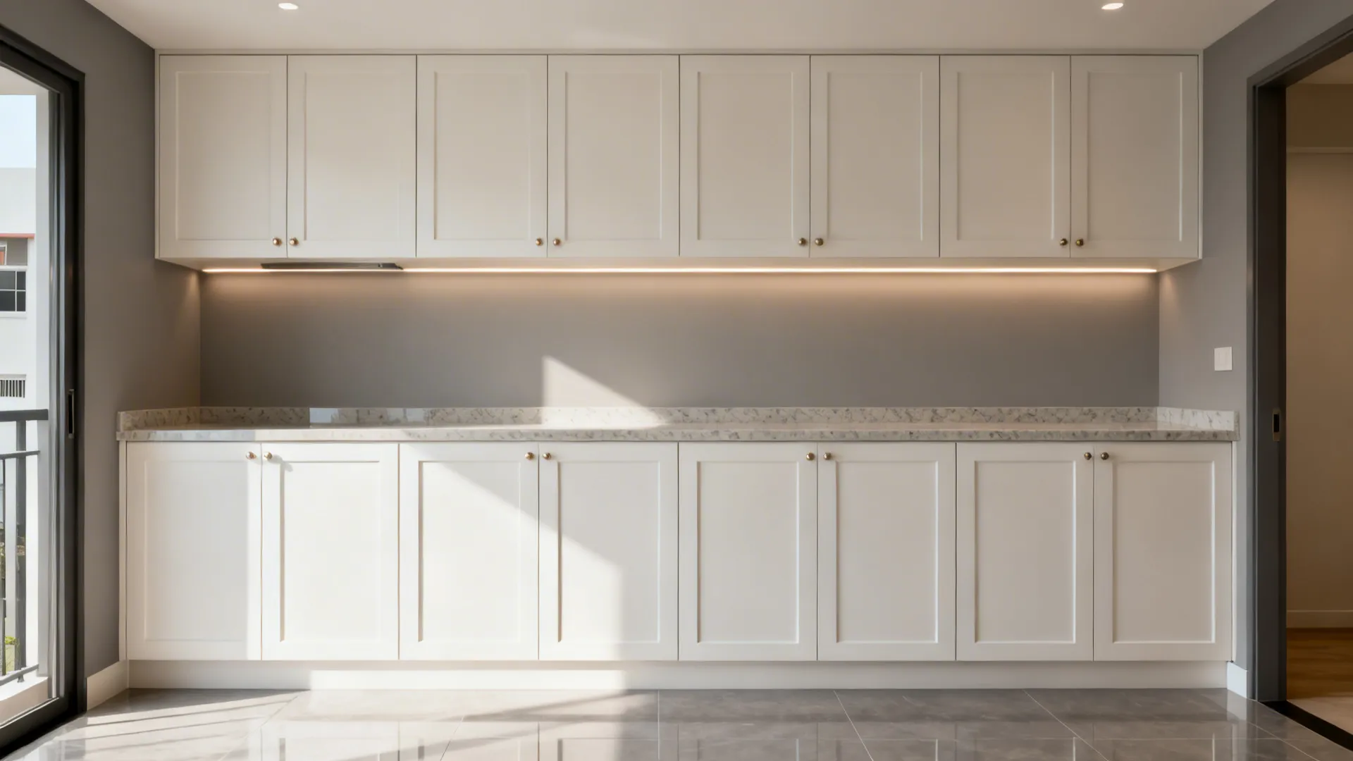 Slim Shaker cabinet run in matte warm white with LED under-cabinet lighting in a small HDB kitchen.