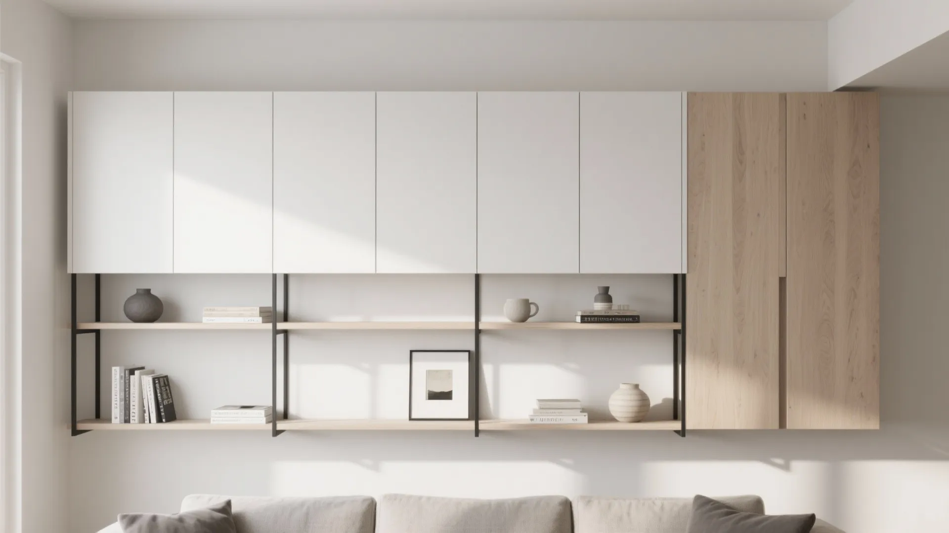 White and wood wall cabinet with open shelves holding books, a picture frame, and vases