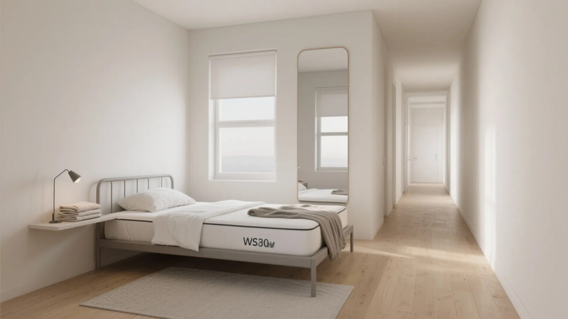 Minimalist white bedroom with a slim single bed window mirror wooden floor and a long hallway
