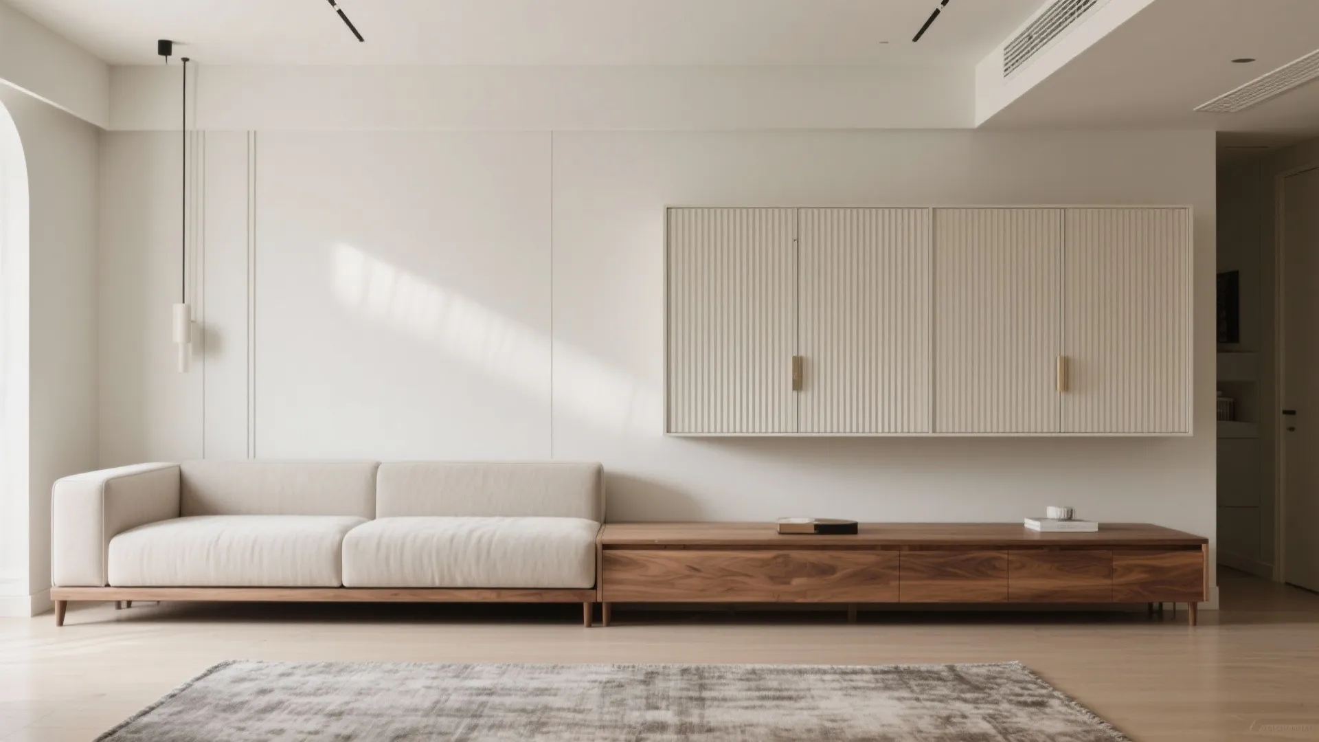Minimalist living room with a long wooden cabinet white sofa and wall panel storage unit design