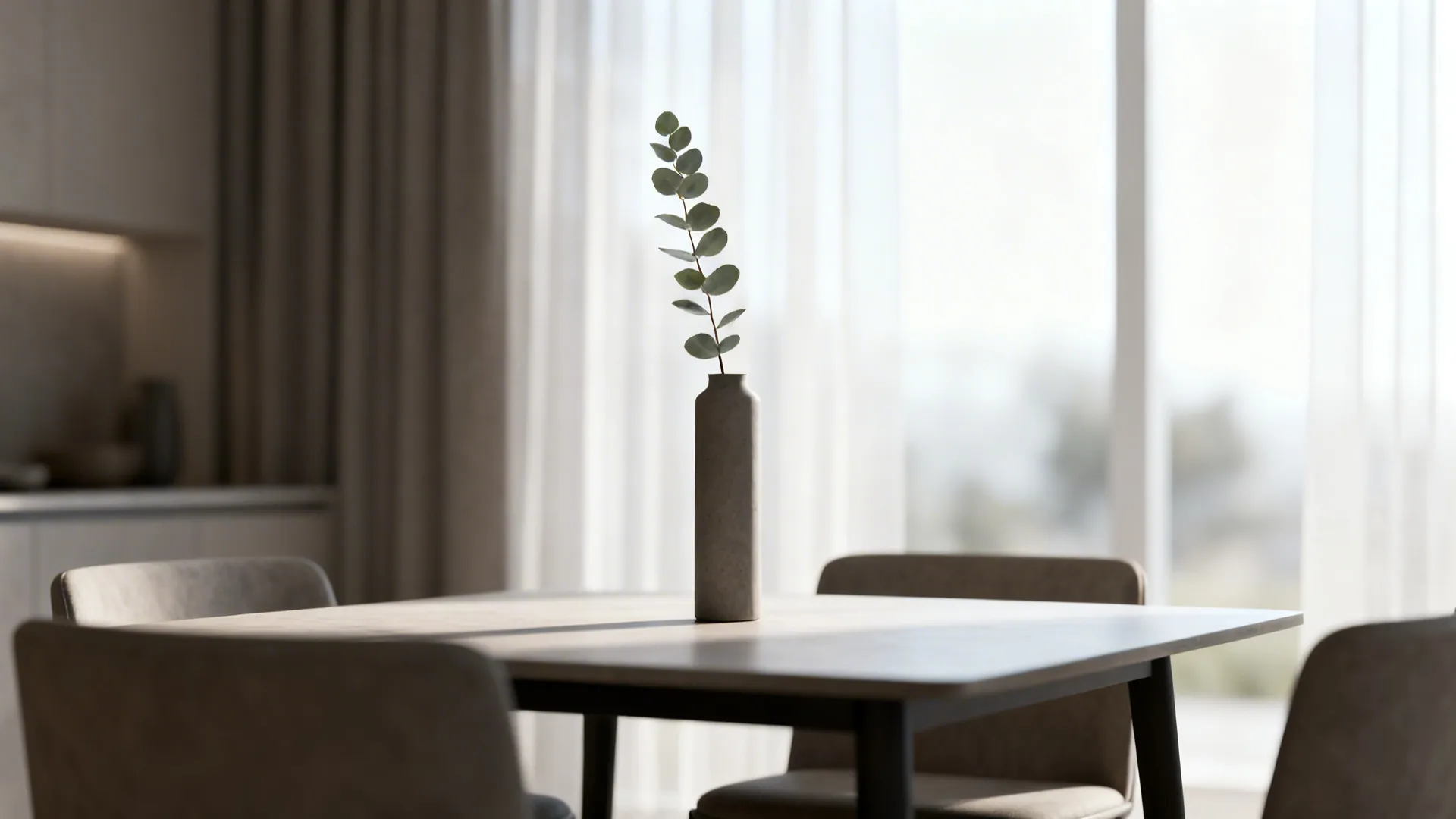 2: A simple green branch in a slim vase